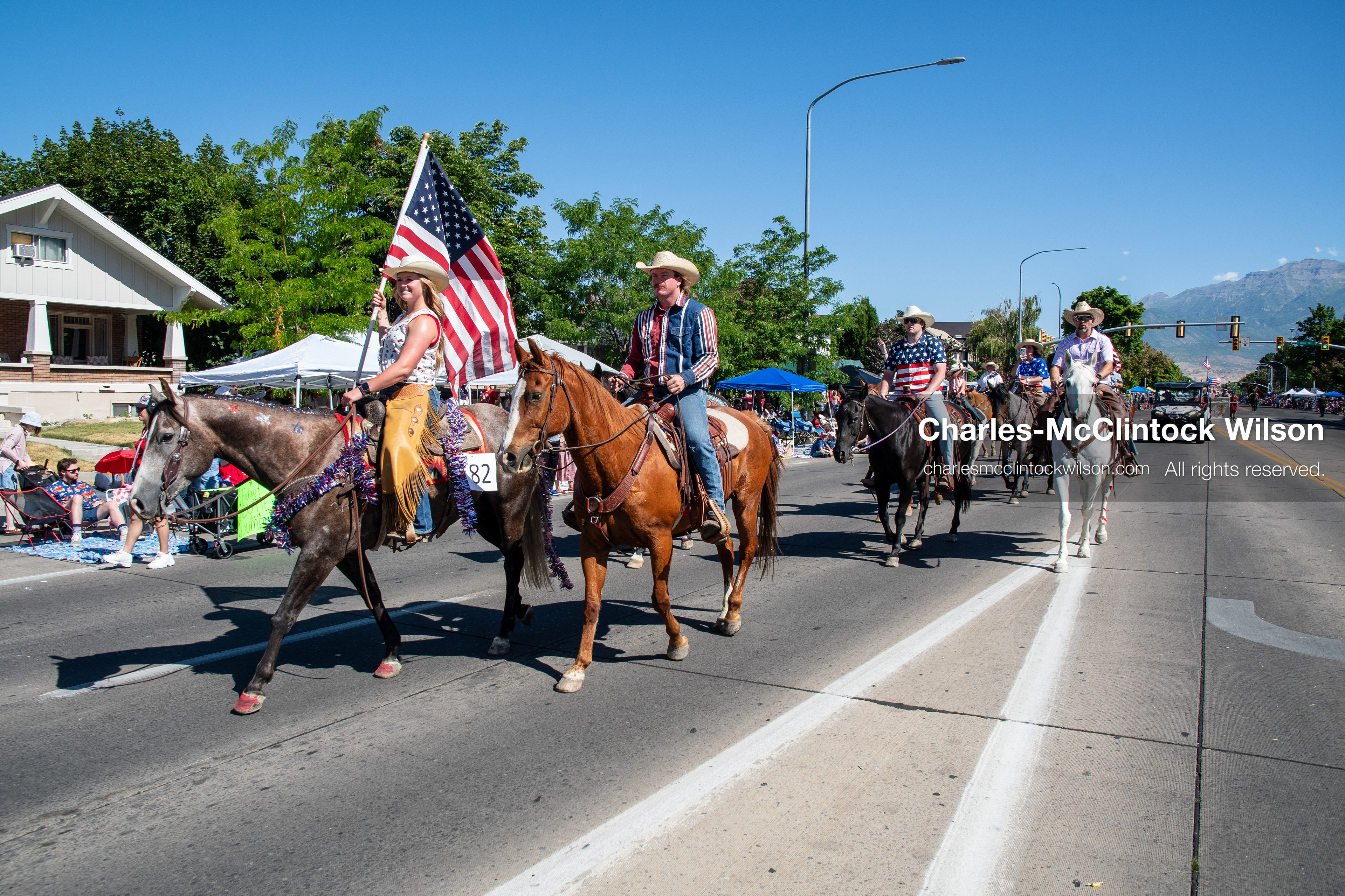 July 4, 2026, Provo, Utah, USA: Equestrian performers wearing cowboy hats ride on horseback down the street while carrying an American flag during America's Freedom Festival Grand Parade in Provo, Utah, Saturday, July 4, 2026. The annual Independence Day event features expanded programming to honor the 250th anniversary of United States independence. (Credit Image: © Charles-McClintock Wilson/ZUMA Press Wire)