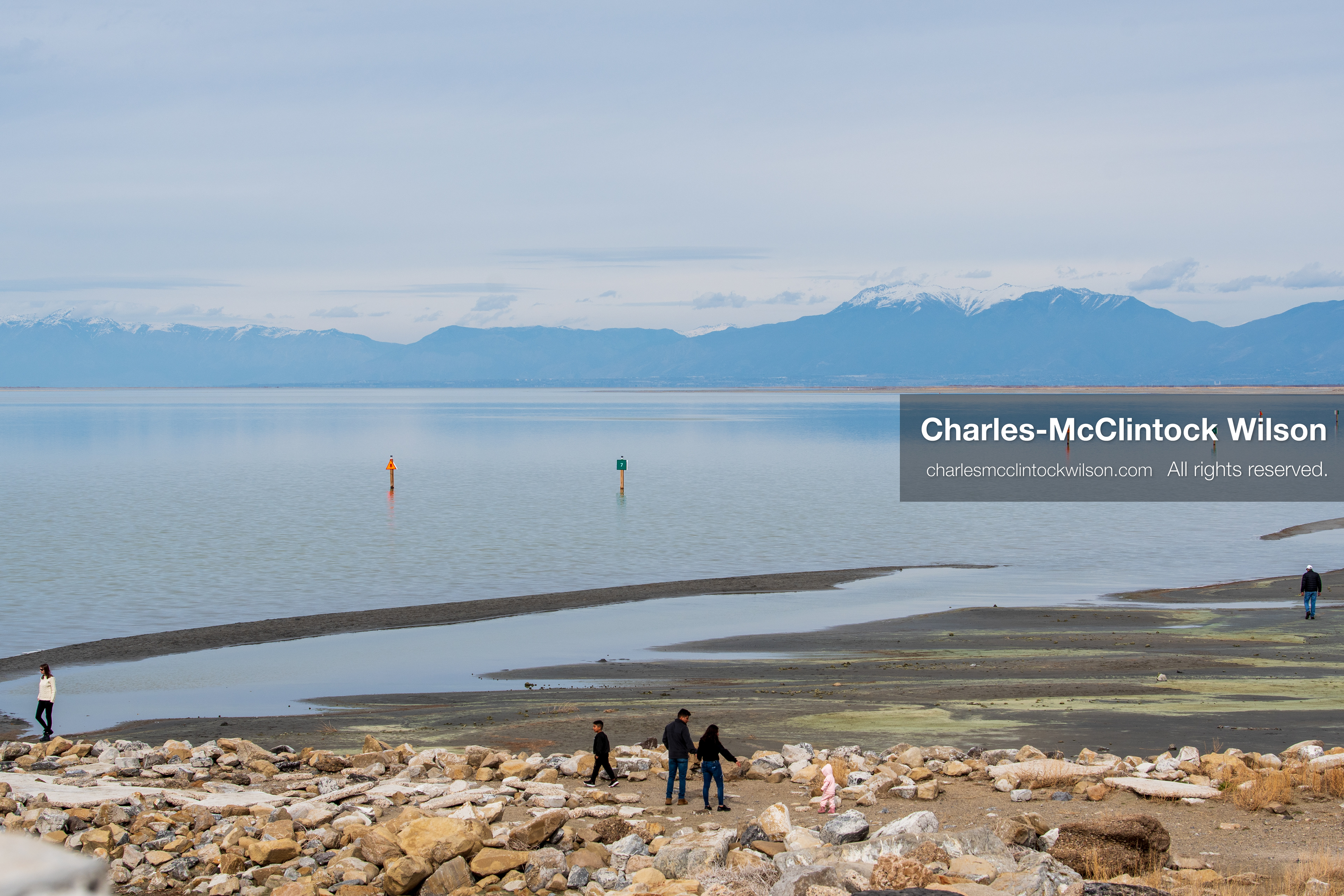March 1, 2026, Great Salt Lake, Utah, USA: People walk along the shoreline of the Great Salt Lake as water levels remain historically low. Reports from state officials and the Great Salt Lake Strike Team state that the lake continues to fall within a serious adverse‑effects range, with elevations among the lowest recorded in more than one hundred years. The lake has drawn increased public attention as lawmakers consider large‑scale water projects and long‑term plans to address declining conditions. (Credit Image: © Charles‑McClintock Wilson/ZUMA Press Wire)