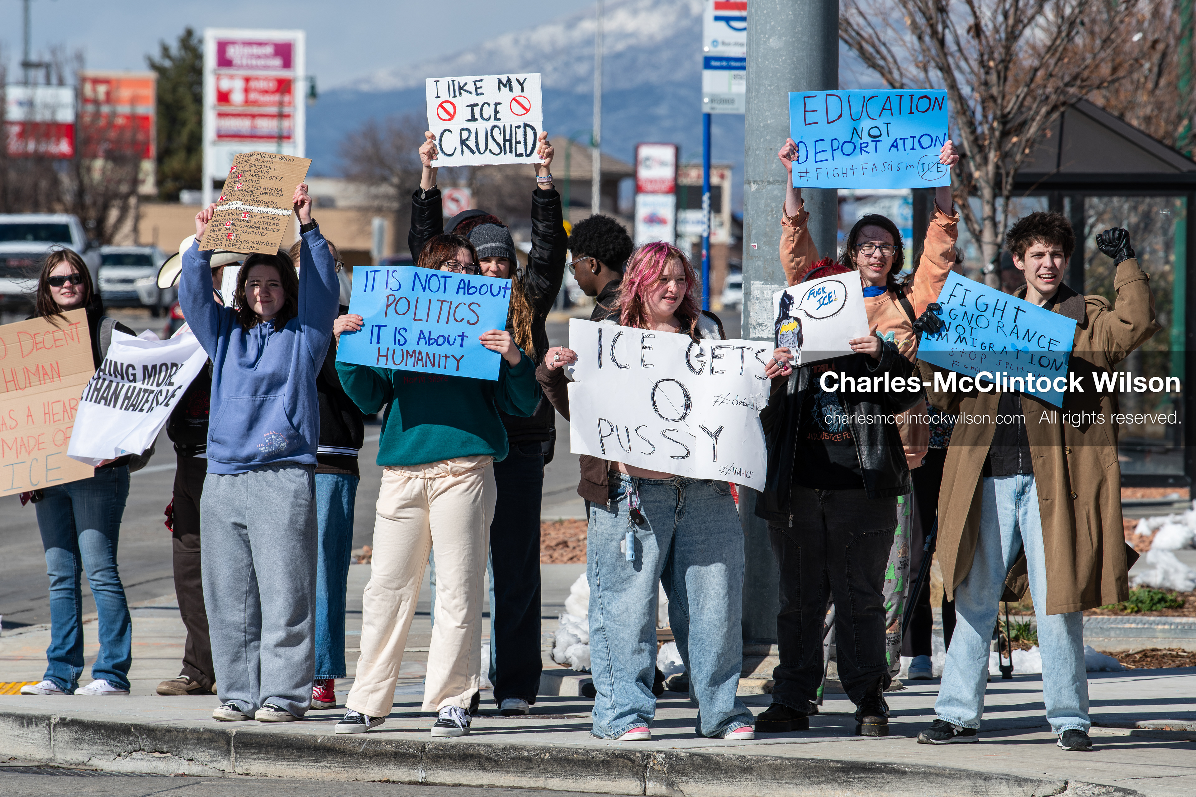 February 20, 2026, Orem, Utah, USA: High school students gather along State Street in front of Orem City Hall during a student led protest against ICE and federal immigration enforcement. Demonstrators hold signs as they stand near the roadway while traffic continues through the area. (Credit Image: © Charles McClintock Wilson/ZUMA Press Wire)