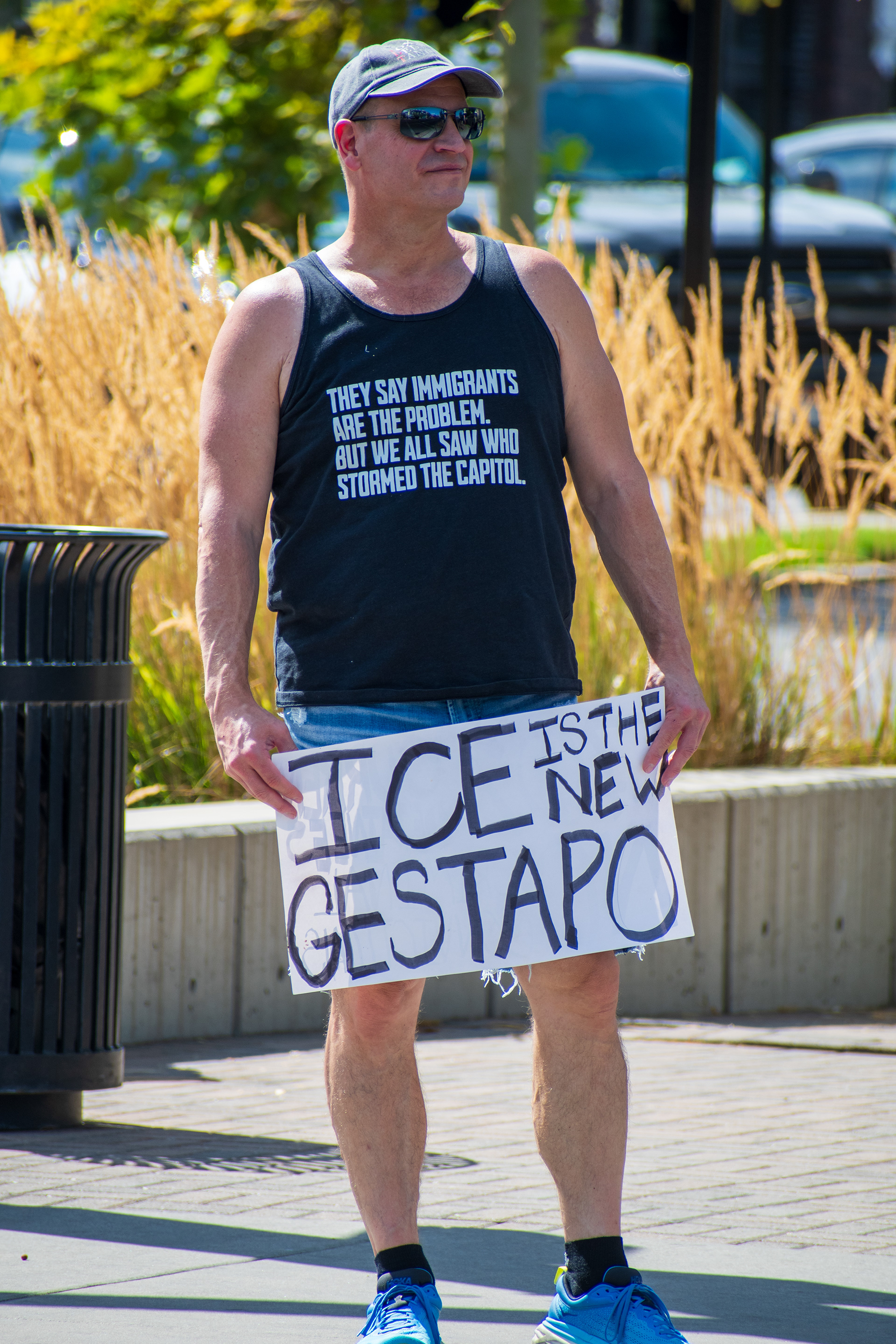 September 15, 2025 – Provo, Utah, United States: A demonstrator holds a protest sign reading “ICE IS THE NEW GESTAPO” outside the Utah Valley Convention Center during the Department of Homeland Security career expo. The individual’s shirt references the January 6 Capitol riot, drawing connections between immigration enforcement and broader political tensions. Photograph by Charles‑McClintock Wilson / ZUMA Press Wire
