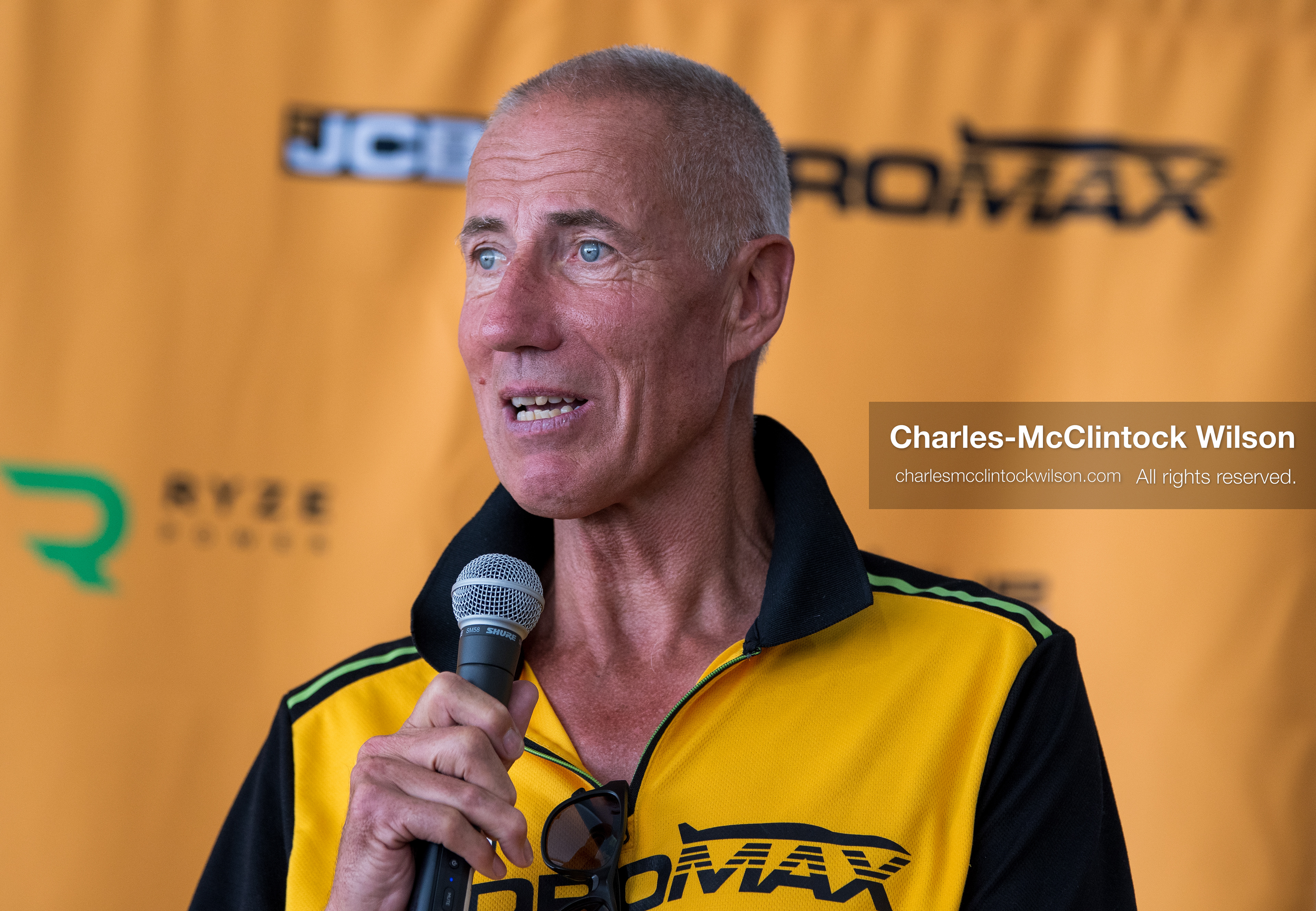  August 11, 2026, Wendover, Utah, USA: British pilot ANDY GREEN speaks into a microphone during a press conference at the Bonneville Salt Flats on Tuesday. Green piloted the hydrogen-powered ''JCB Hydromax'' streamliner to a historic record-breaking top speed of 406.320 mph. (Credit Image: © Charles McClintock Wilson/ZUMA Press Wire)