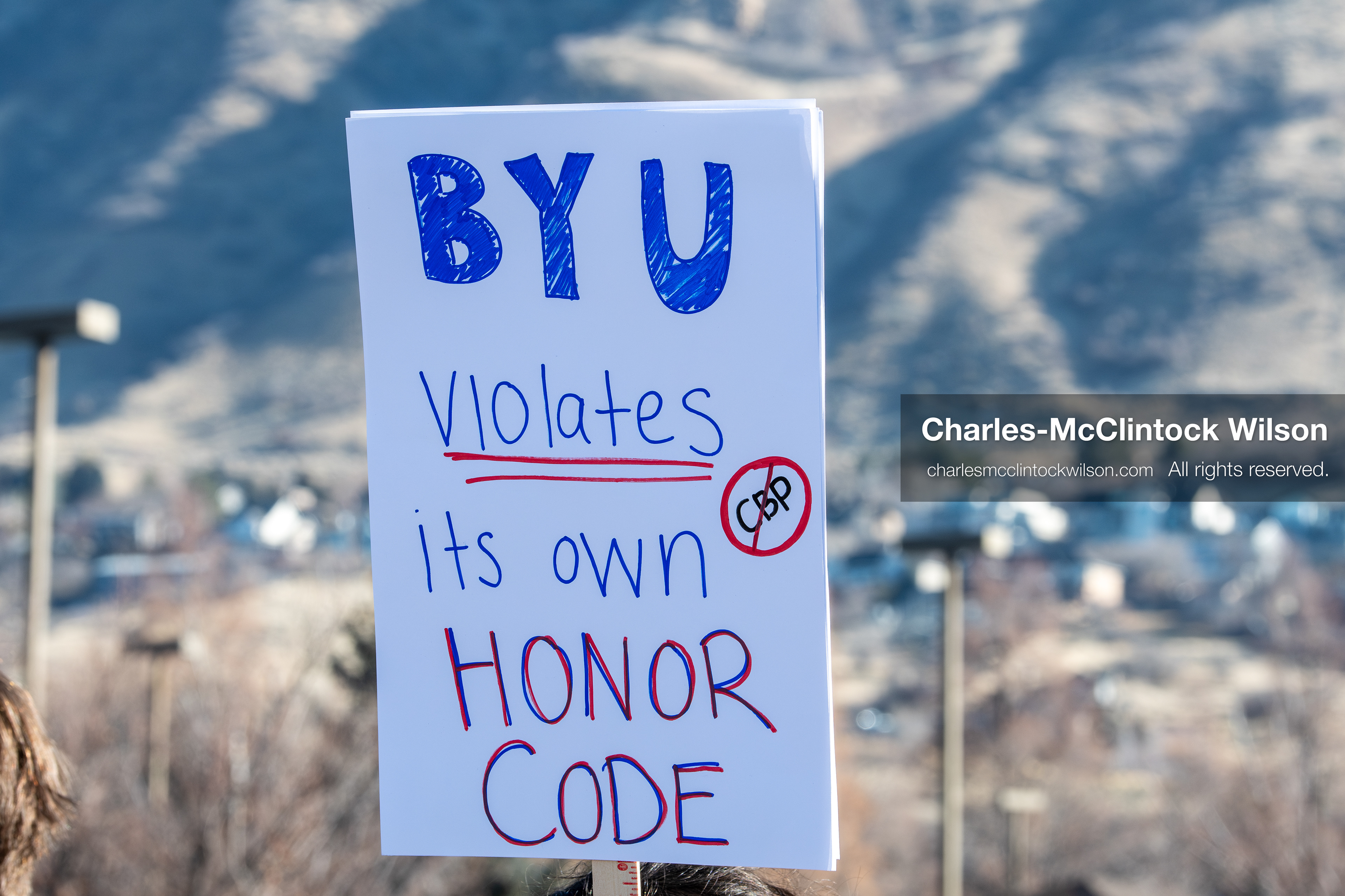 February 5, 2026, Provo, Utah, USA: A demonstrator holds a sign during a gathering near Brigham Young University in Provo where students and community members protested the presence of US Customs and Border Protection recruiters at a career fair held on the BYU campus. (Credit Image: © Charles McClintock Wilson/ZUMA Press Wire)