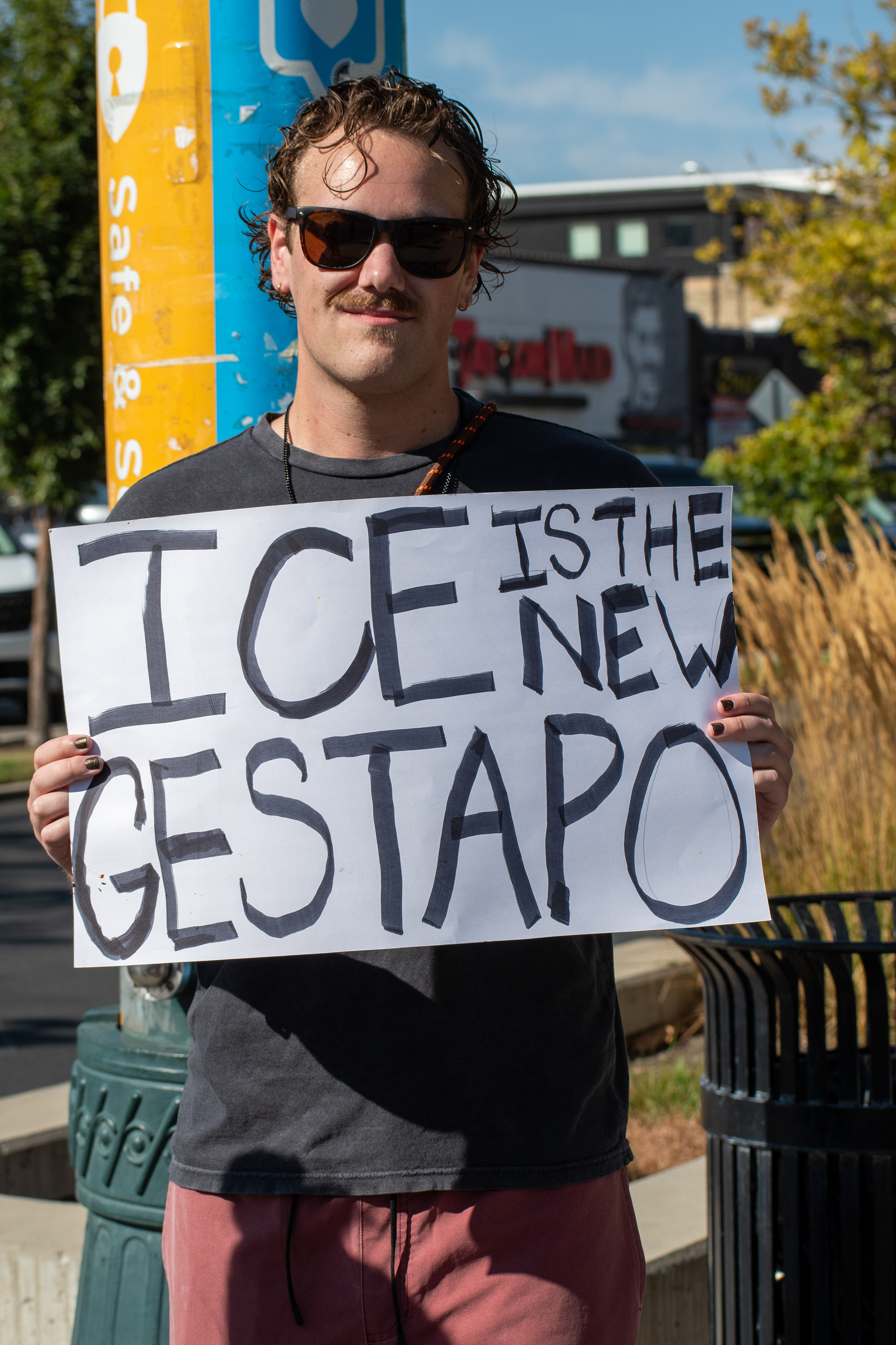 September 15, 2025 – Provo, Utah, United States: A demonstrator holds a sign reading “ICE IS THE NEW GESTAPO” outside the Utah Valley Convention Center during a protest against the Department of Homeland Security career expo. The message draws historical parallels and critiques immigration enforcement practices. Photograph by Charles‑McClintock Wilson / ZUMA Press Wire