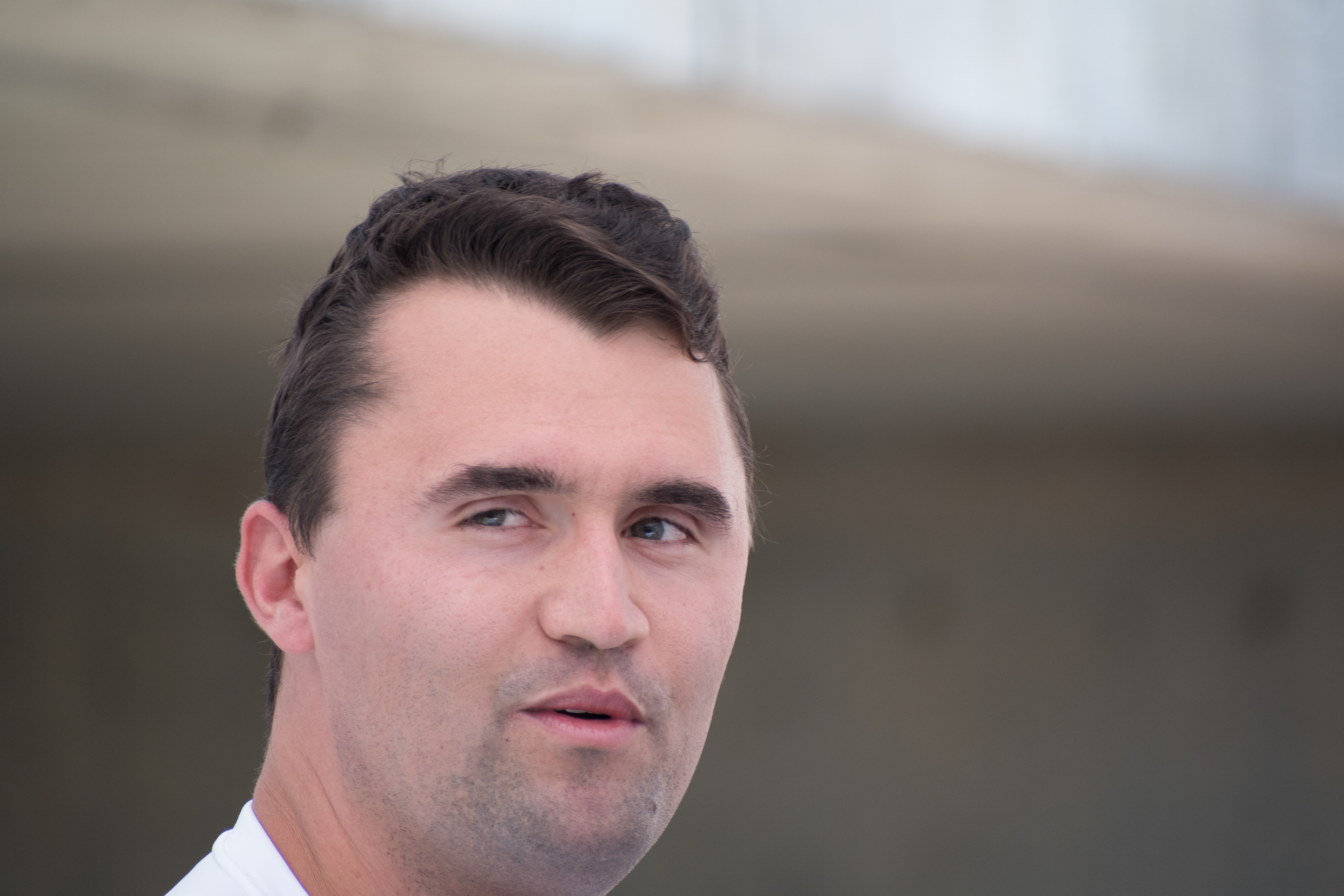 OREM, UTAH – SEPTEMBER 10, 2025: Charlie Kirk reacts during a public appearance at Utah Valley University, where he addressed supporters and engaged with attendees in the UVU Courtyard. Captured mid-expression, Kirk looks directly at the camera as media crews and onlookers gather around him. The image reflects the immediacy and intensity of his final public engagement before the shooting incident that disrupted the event. © Charles-McClintock Wilson / ZUMA Press