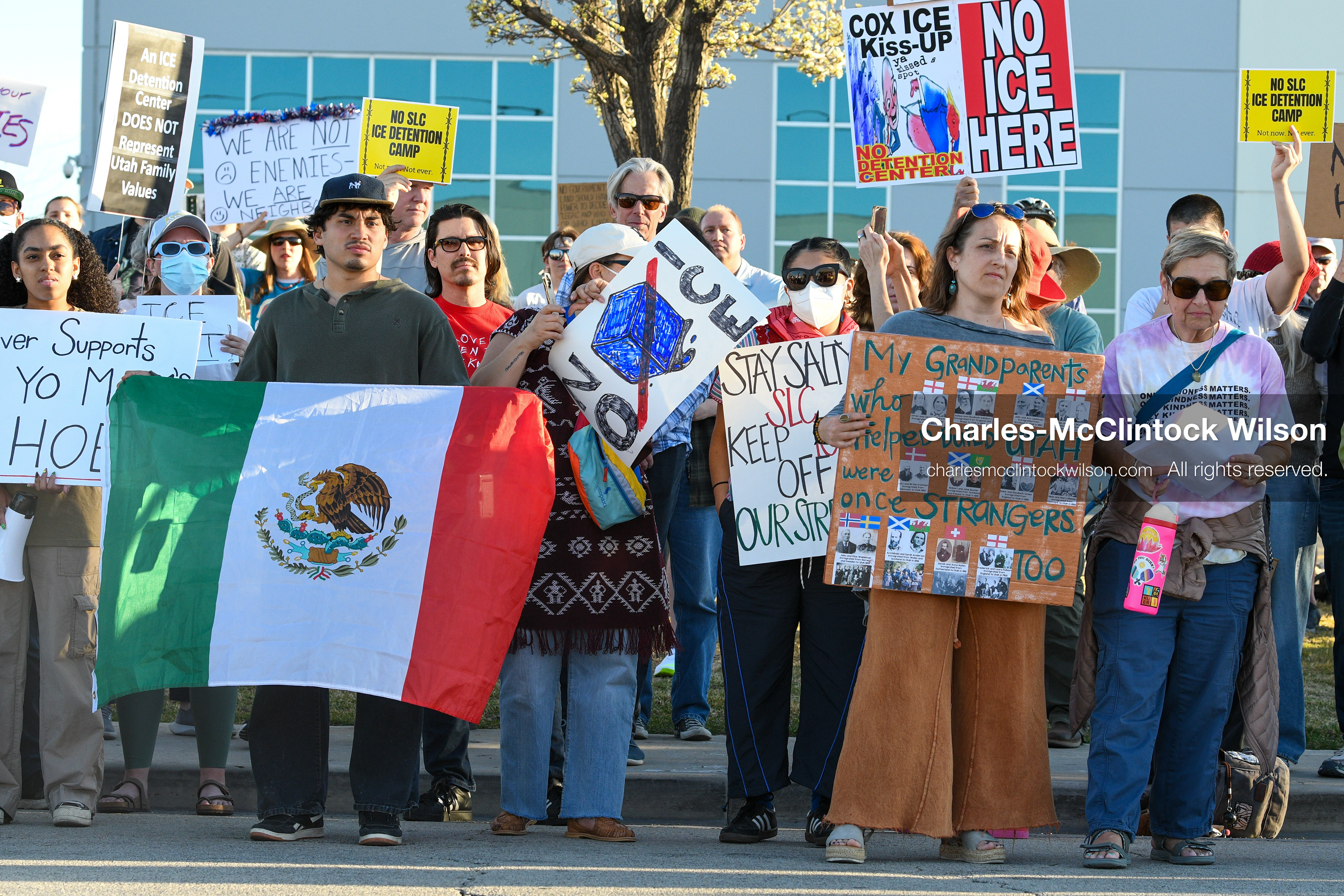 March 18, 2026, Salt Lake City, Utah, USA: Demonstrators gather at the site of a proposed ICE detention facility on the west side of Salt Lake City. Participants hold signs and a Mexican flag during the protest as the crowd assembles near the warehouse property. (Credit Image: © Charles McClintock Wilson/ZUMA Press Wire)