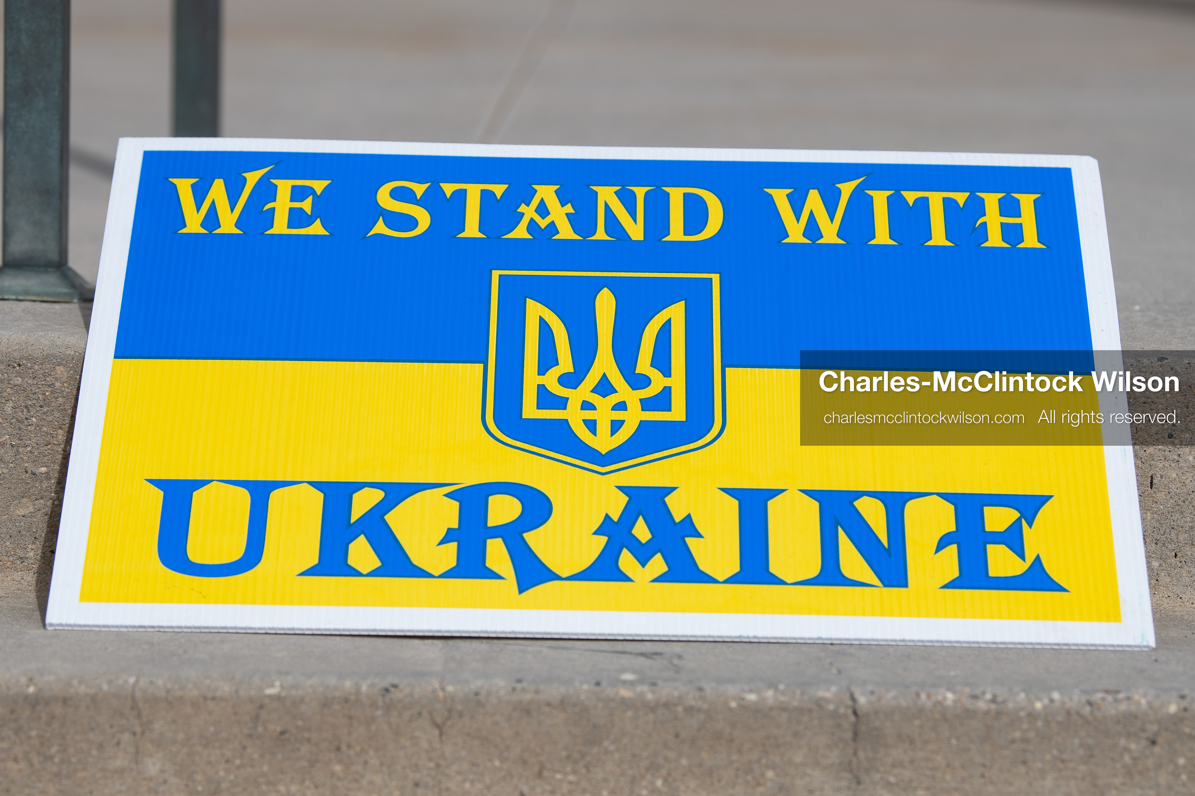 February 28, 2026, Salt Lake City, Utah, USA: A sign reading We Stand With Ukraine in the colors of the Ukrainian flag rests against a railing during the Stand With Ukraine rally at the Utah State Capitol. The gathering marked the four year anniversary of the full scale Russian invasion of Ukraine and brought community members together in support of Ukrainians and local humanitarian efforts. (Credit Image: © Charles McClintock Wilson/ZUMA Press Wire)
