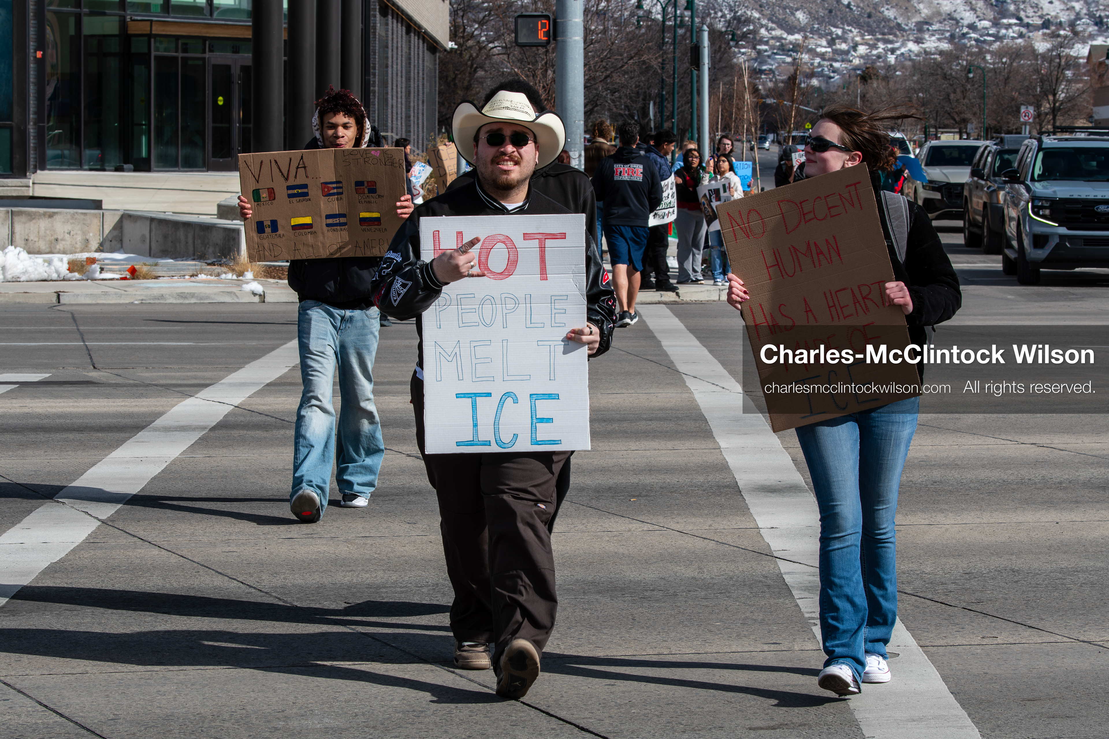 February 20, 2026, Orem, Utah, USA: Participants cross State Street in front of Orem City Hall during a student led protest against ICE. Demonstrators move through the crosswalk as vehicles wait in the area. (Credit Image: © Charles McClintock Wilson/ZUMA Press Wire)