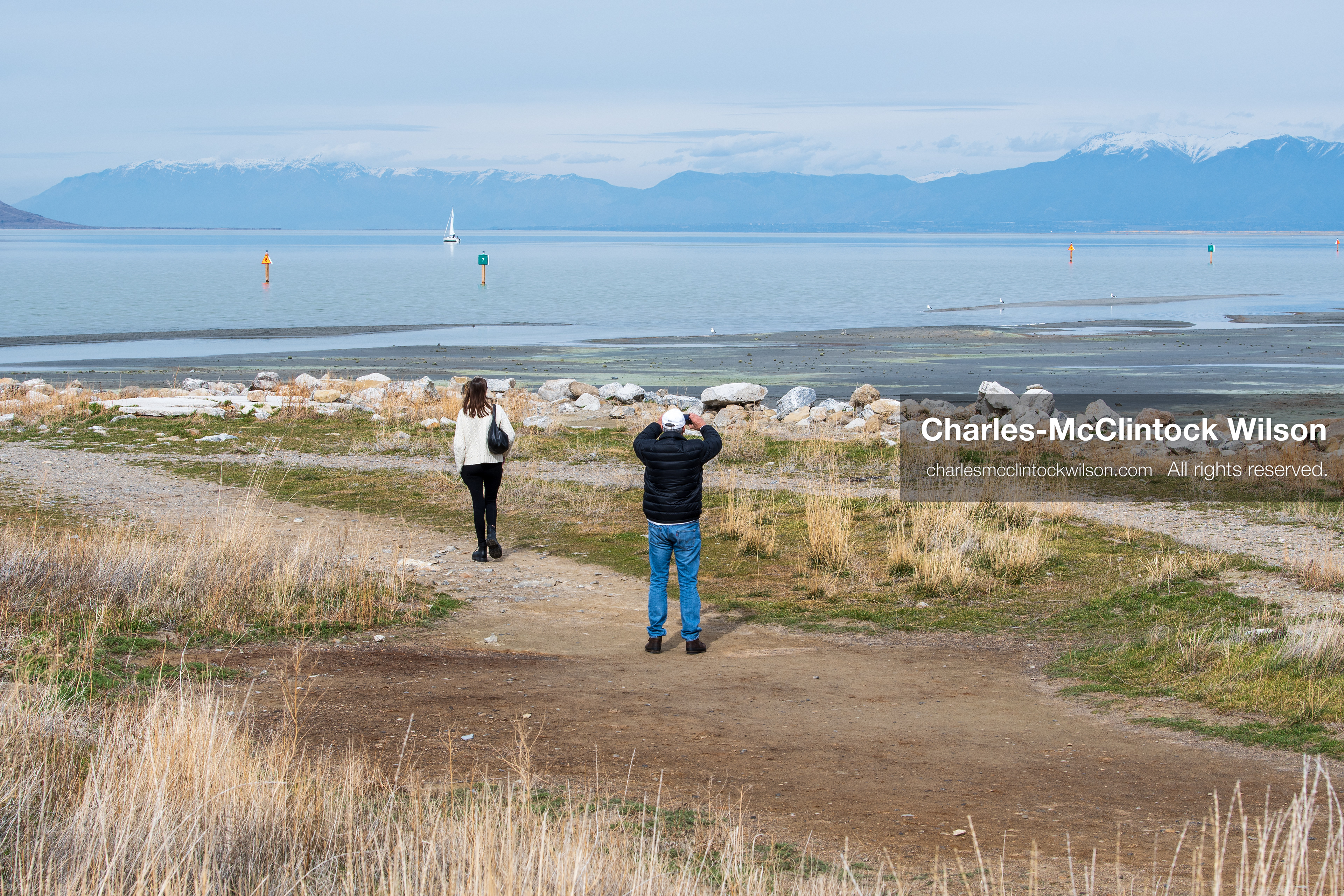 March 1, 2026, Great Salt Lake, Utah, USA: People walk along a path near the shoreline of the Great Salt Lake as the region continues to experience historically low water levels. Reports from state officials and the Great Salt Lake Strike Team state that the lake remains in a serious adverse‑effects range, with elevations among the lowest recorded in more than one hundred years. The lake has drawn increased public attention as lawmakers consider large‑scale water projects and long‑term plans to address declining conditions. (Credit Image: © Charles‑McClintock Wilson/ZUMA Press Wire)
