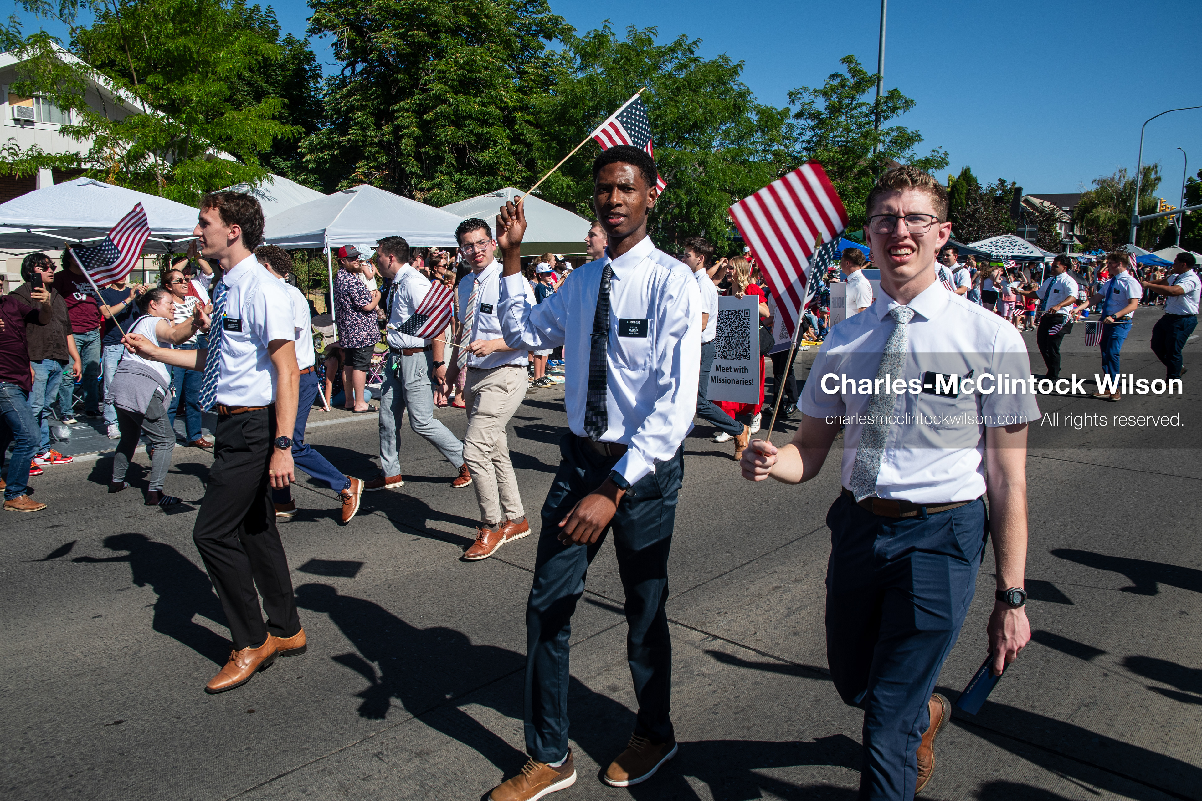 July 4, 2026, Provo, Utah, USA: Missionaries from The Church of Jesus Christ of Latter-day Saints wear black name badges and wave American flags while marching down the street during America's Freedom Festival Grand Parade in Provo, Utah, Saturday, July 4, 2026. The annual Independence Day event features expanded programming to honor the 250th anniversary of United States independence. (Credit Image: © Charles-McClintock Wilson/ZUMA Press Wire)