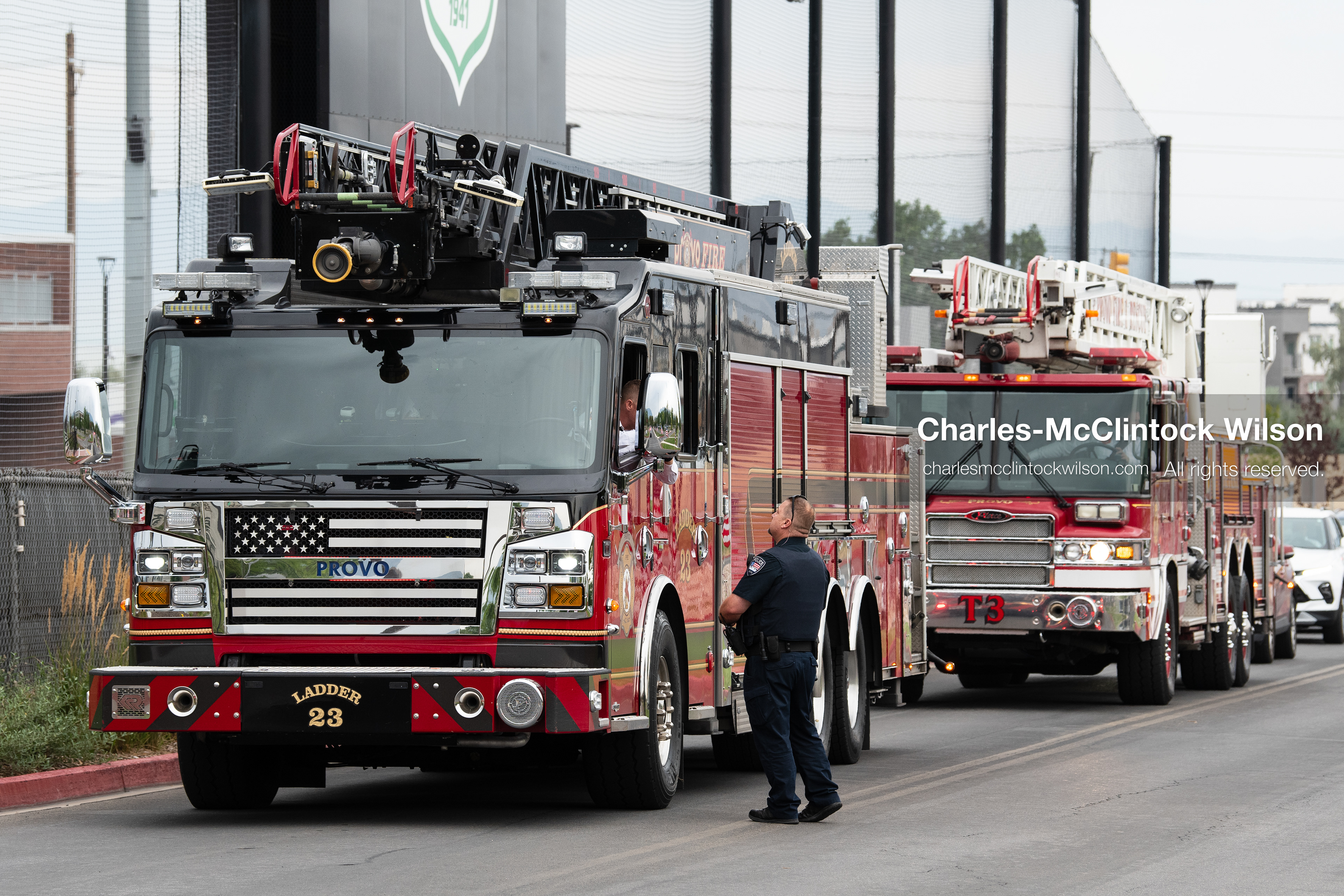 Provo Fire Department engines sit parked along the roadway outside the UCCU Center at Utah Valley University in Orem, Utah, on Wednesday, July 29, 2026. More than 300 people came to the public memorial ceremony to honor Provo Fire Captain Spencer Long, his wife Katrina, and three of their sons, who died after a flash flood hit their campsite near the Sunglow Campground in Wayne County. (Photo by Charles-McClintock Wilson/Sipa USA)