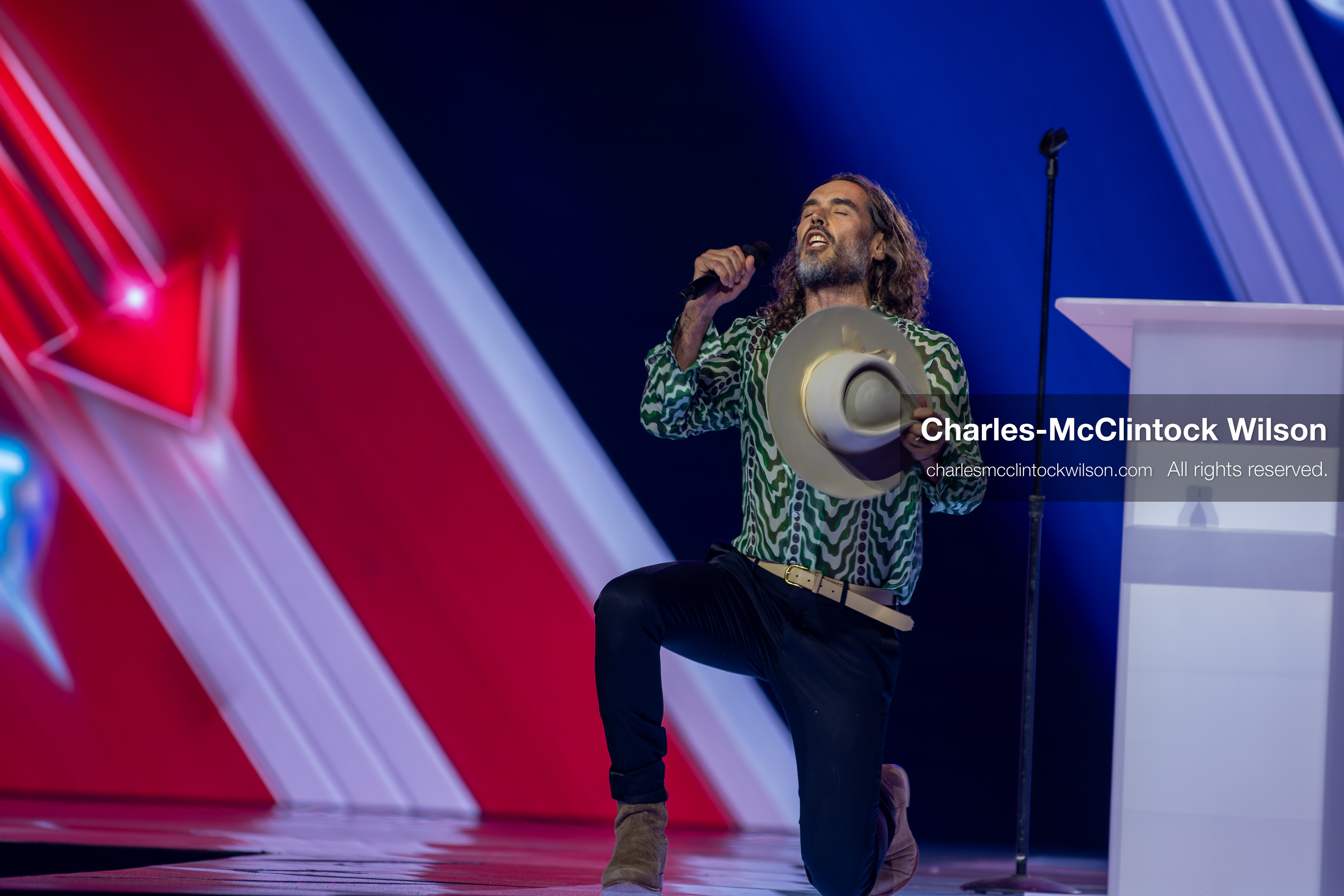December 18, 2025, Phoenix, Arizona, USA: Russell Brand speaks during Day One of Turning Point USA’s AmericaFest 2025 at the Phoenix Convention Center in Phoenix, Arizona.   (Credit Image: © Charles‑McClintock Wilson/ZUMA Press Wire)