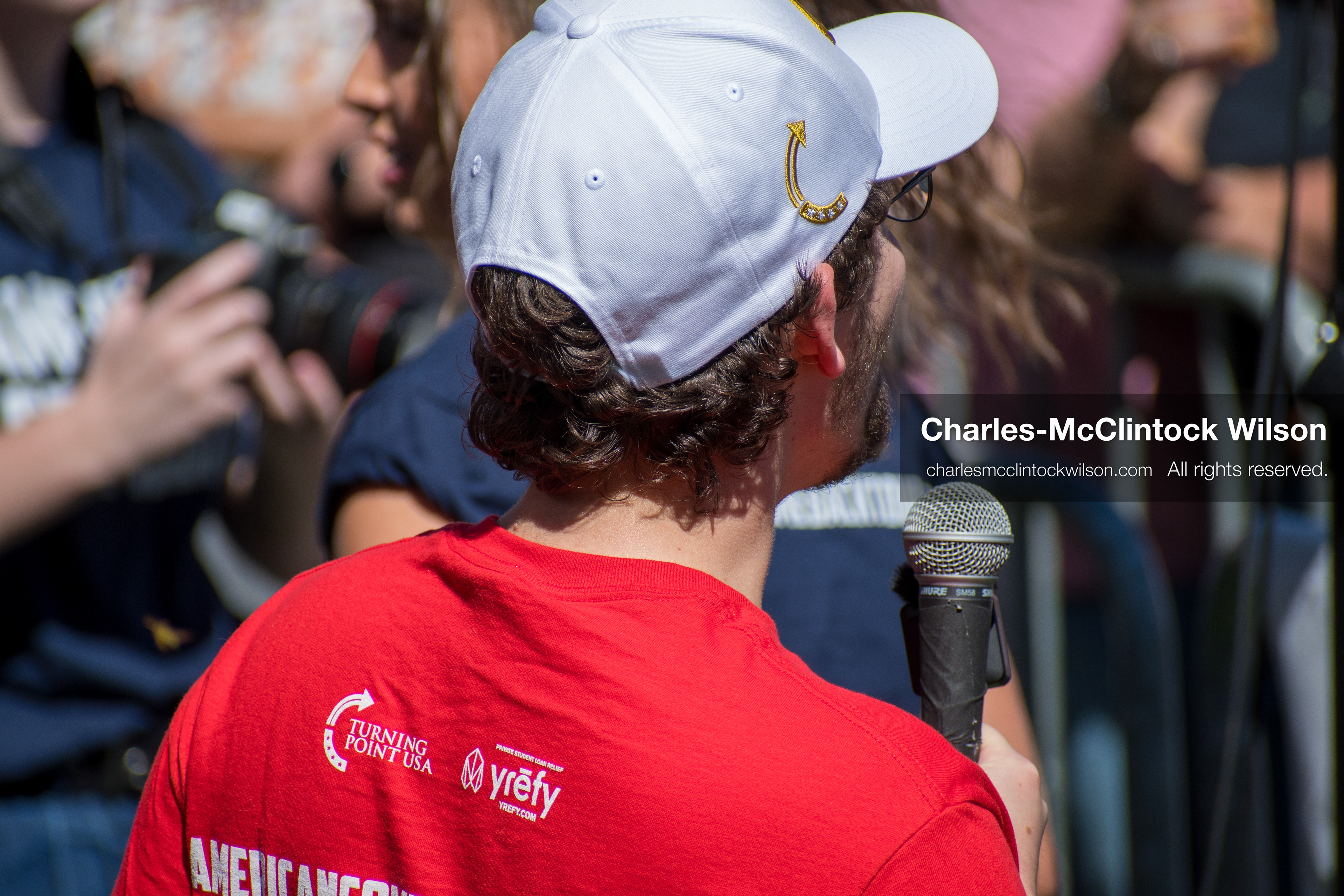September 10, 2025, Orem, Utah, USA: A staff member from Turning Point USA speaks into a microphone during conservative activist Charlie Kirk’s American Comeback Tour appearance at Utah Valley University. The event, held at the Fountain Courtyard, drew over 3,000 attendees and was marked by heightened civic tension and symbolic gestures from across the political spectrum. Kirk was fatally shot moments later during the public Q&A session, prompting national scrutiny of campus security protocols and institutional response. (Credit Image: © Charles‑McClintock Wilson/All rights reserved)