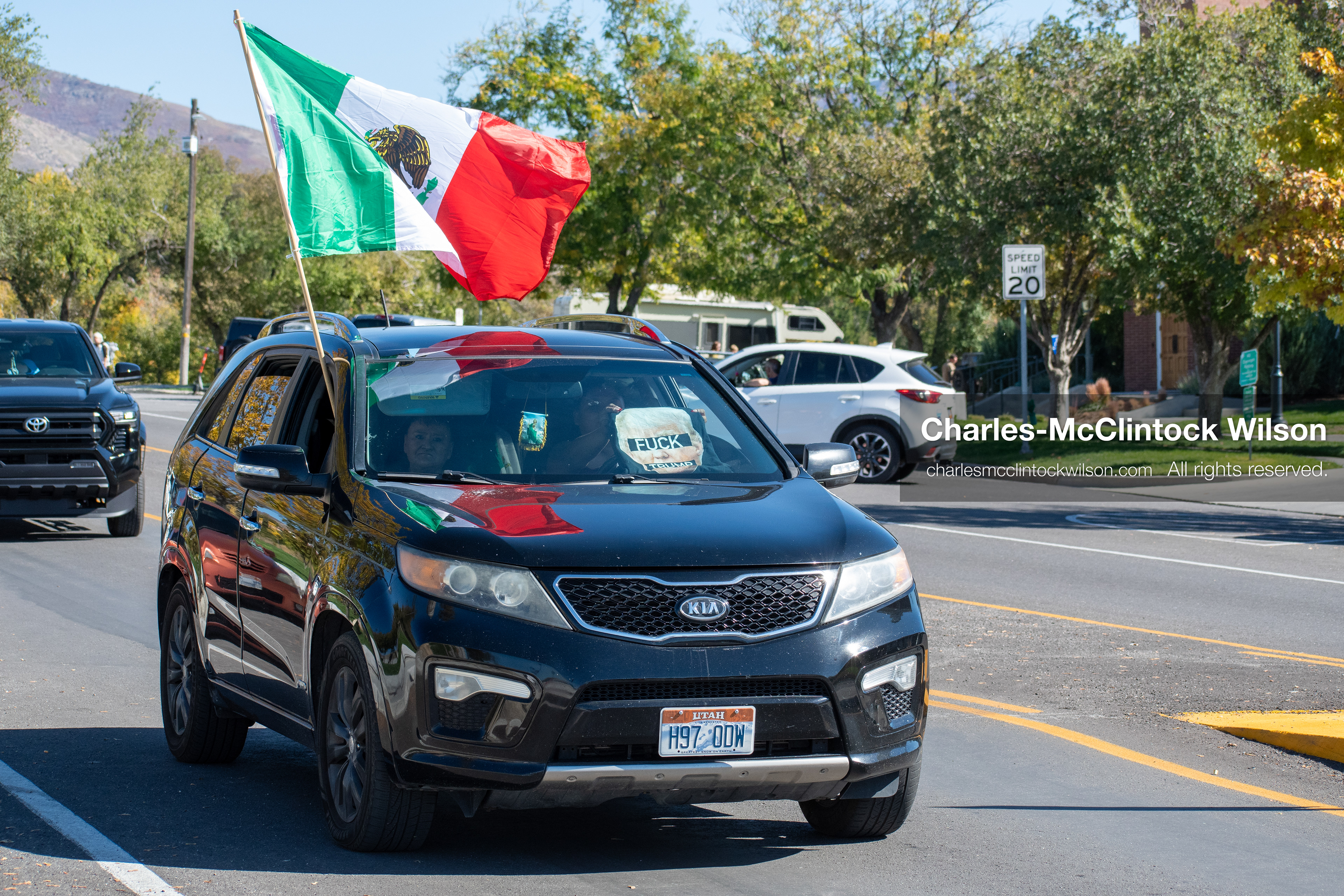 October 18, 2025, Salt Lake City, Utah, USA: A black SUV displays a Mexican flag during a "No Kings" protest at the Utah State Capitol. The protest was part of a nationwide mobilization.