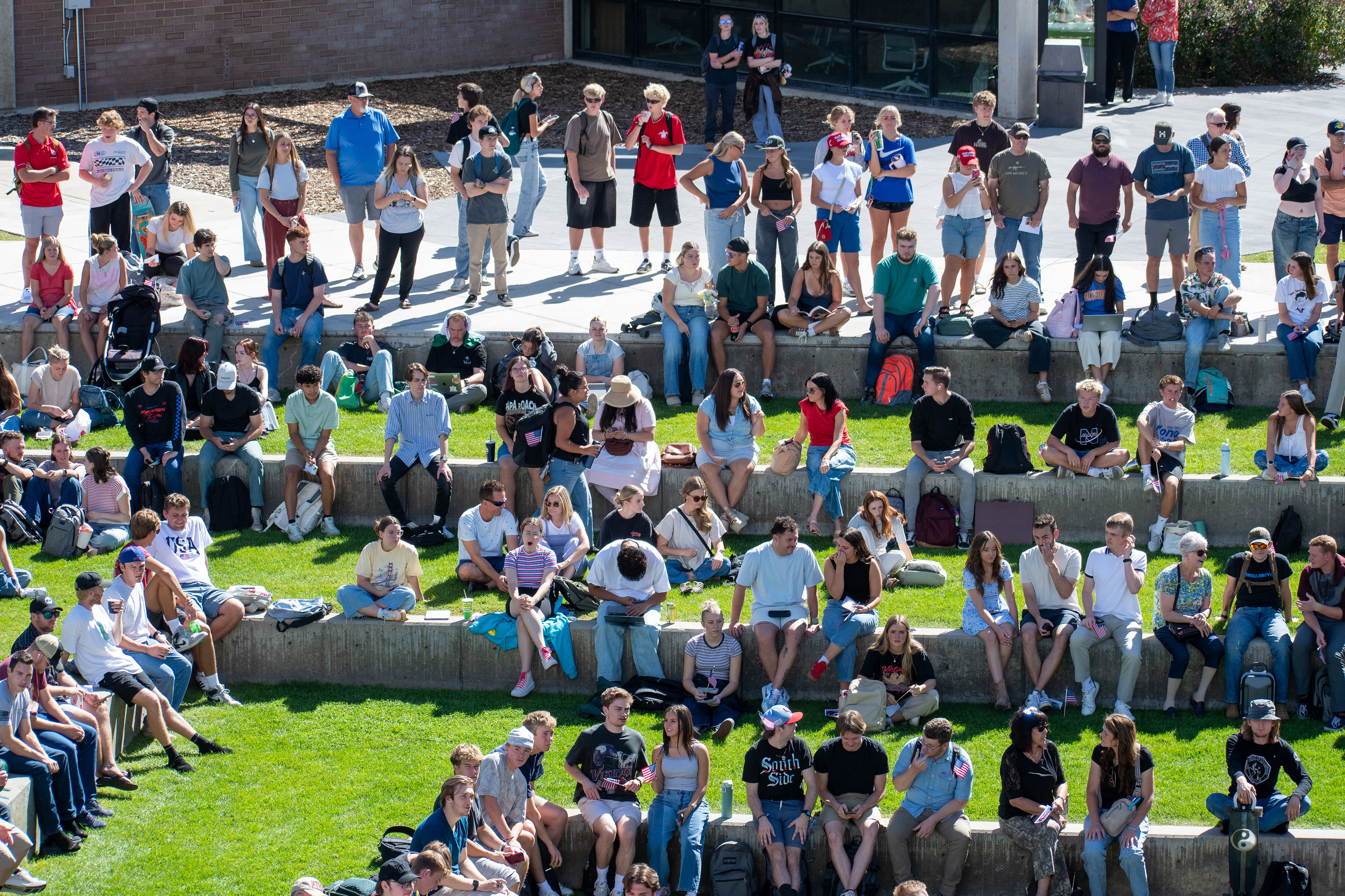 OREM, UTAH – SEPTEMBER 10, 2025: Attendees gather across the lawn and walkways at Utah Valley University during the opening stop of the American Comeback Tour. Seated and standing in casual formation, the crowd reflects a moment of civic presence, curiosity, and communal engagement. The image captures the spatial texture and emotional tone of a public event designed to connect, energize, and engage. © Charles-McClintock Wilson / ZUMA Press