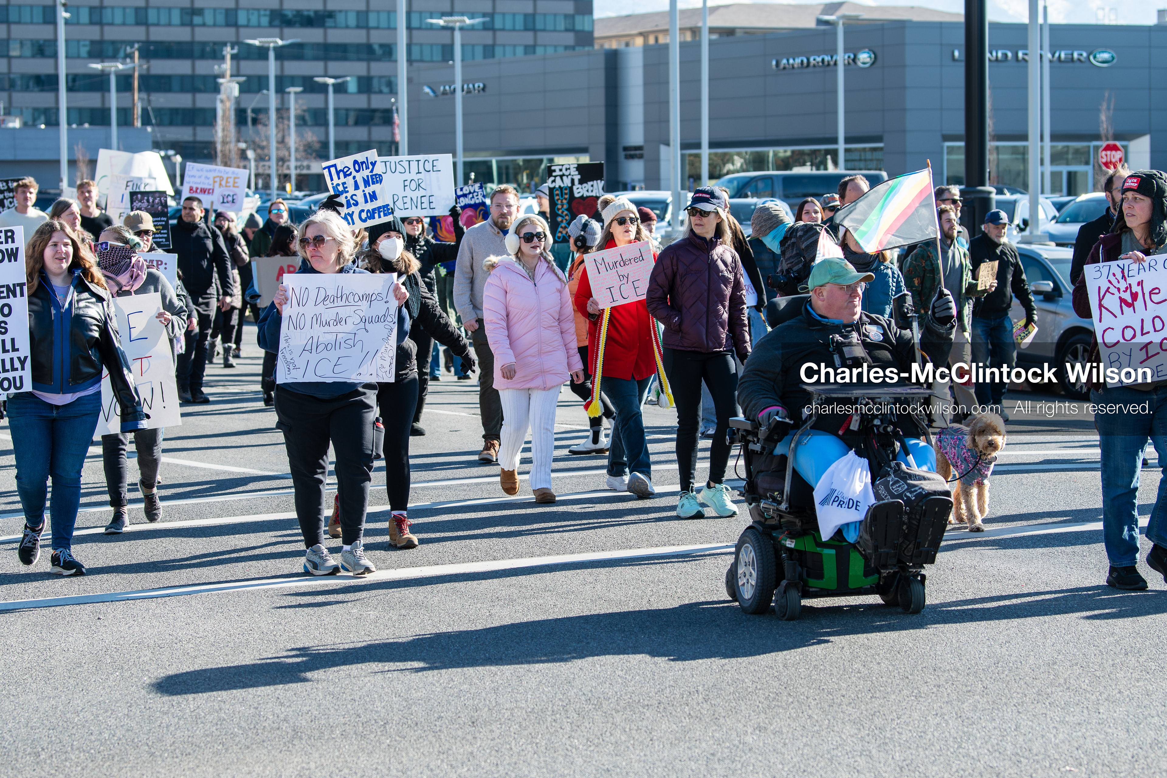 Salt Lake City, Utah, January 10, 2026: A group of demonstrators marches through downtown Salt Lake City during the ICE Out for Good protest, which began at Washington Square Park, with participants carrying signs and personal items as they walk together. (Credit Image: © Charles‑McClintock Wilson/ZUMA Press Wire)
