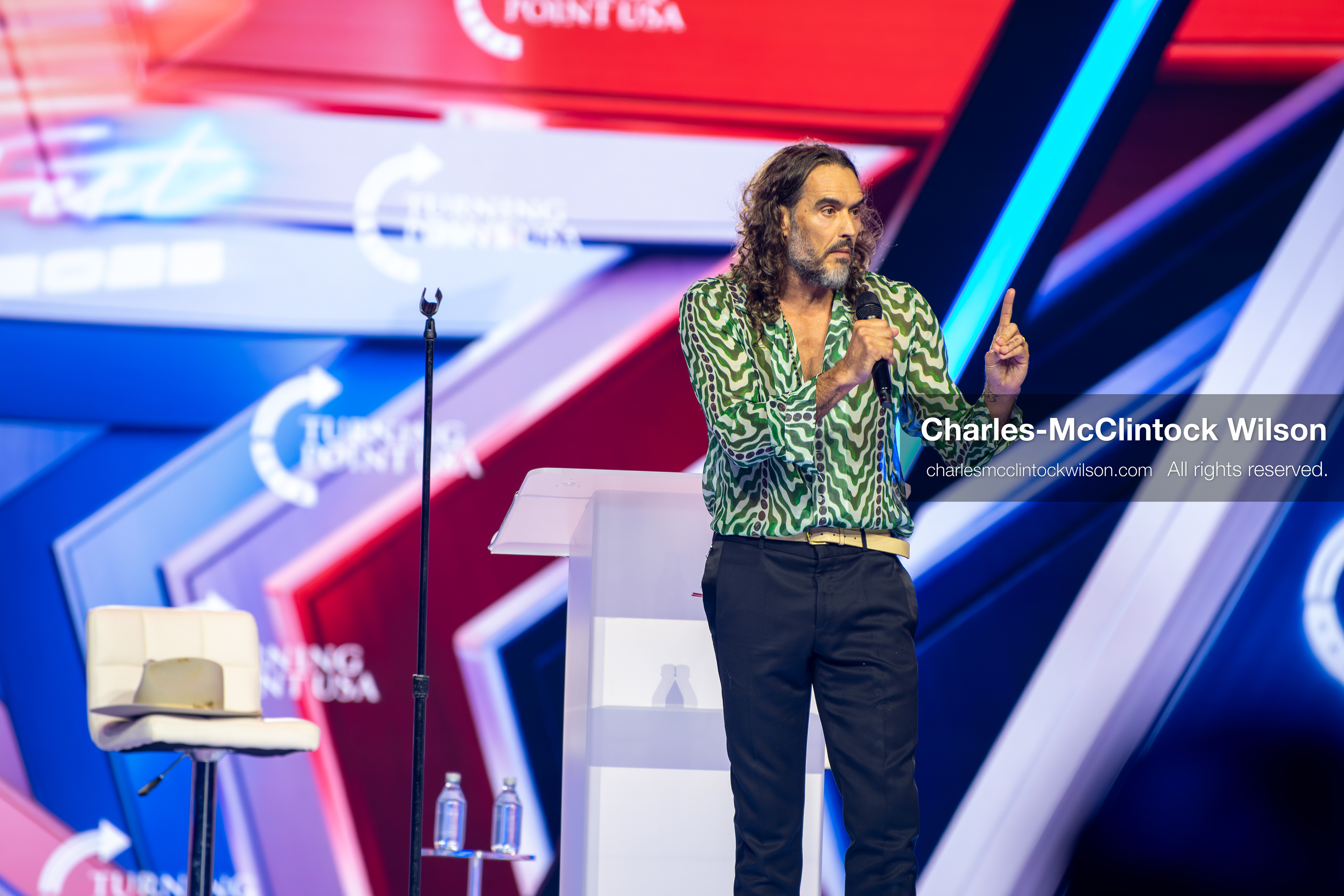 December 18, 2025, Phoenix, Arizona, USA: Russell Brand speaks during Day One of Turning Point USA’s AmericaFest 2025 at the Phoenix Convention Center in Phoenix, Arizona.   (Credit Image: © Charles‑McClintock Wilson/ZUMA Press Wire)