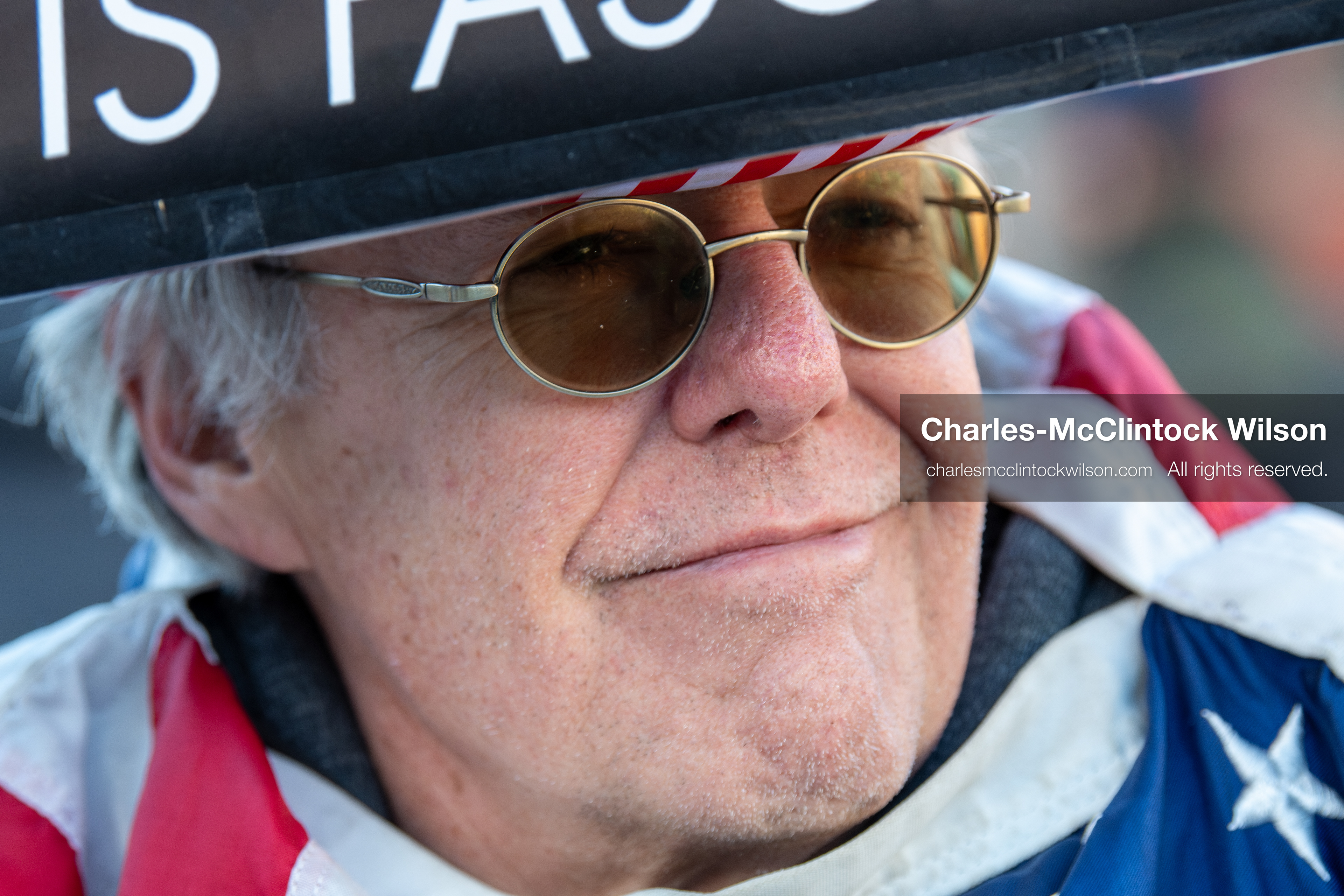 January 26, 2026, Park City, Utah, USA: A demonstrator dressed in an American flag-themed outfit holds a sign while participating in a protest opposing U.S. Immigration and Customs Enforcement (I.C.E.) ICE agents at the Sundance Film Festival in Park City, Utah, on Monday, Jan. 26, 2026. The event was held in response to the fatal shooting of Alex Pretti by a U.S. Border Patrol officer in Minneapolis. (Credit Image: © Charles McClintock Wilson/ZUMA Press Wire)