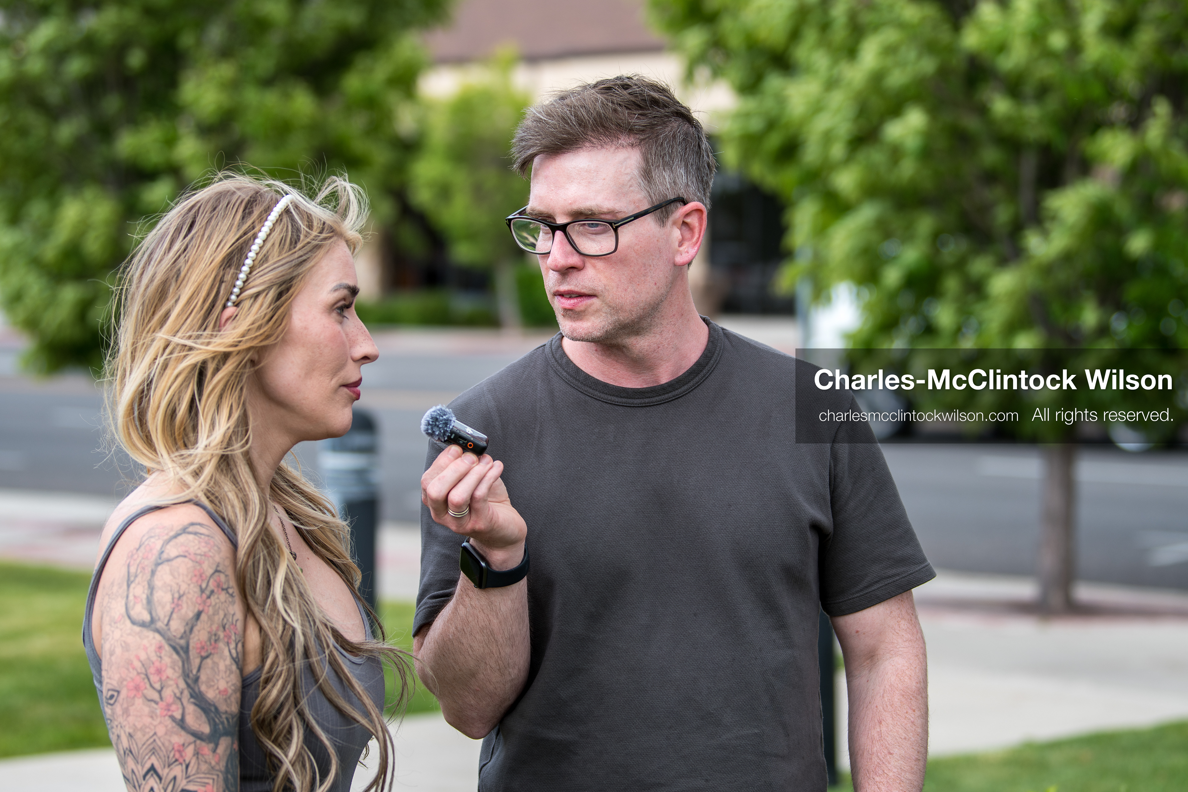 May 13, 2026, Brigham City, Utah, USA: US political satirist and digital creator WALTER MASTERSON interviews a woman outside the Box Elder County Justice Courthouse in Brigham City, Utah, during a gathering over the proposed data‑center project backed by businessman Kevin O’Leary, which has drawn public concern over water use, power demand, and transparency. (Credit Image: © Charles‑McClintock Wilson/ZUMA Press Wire)