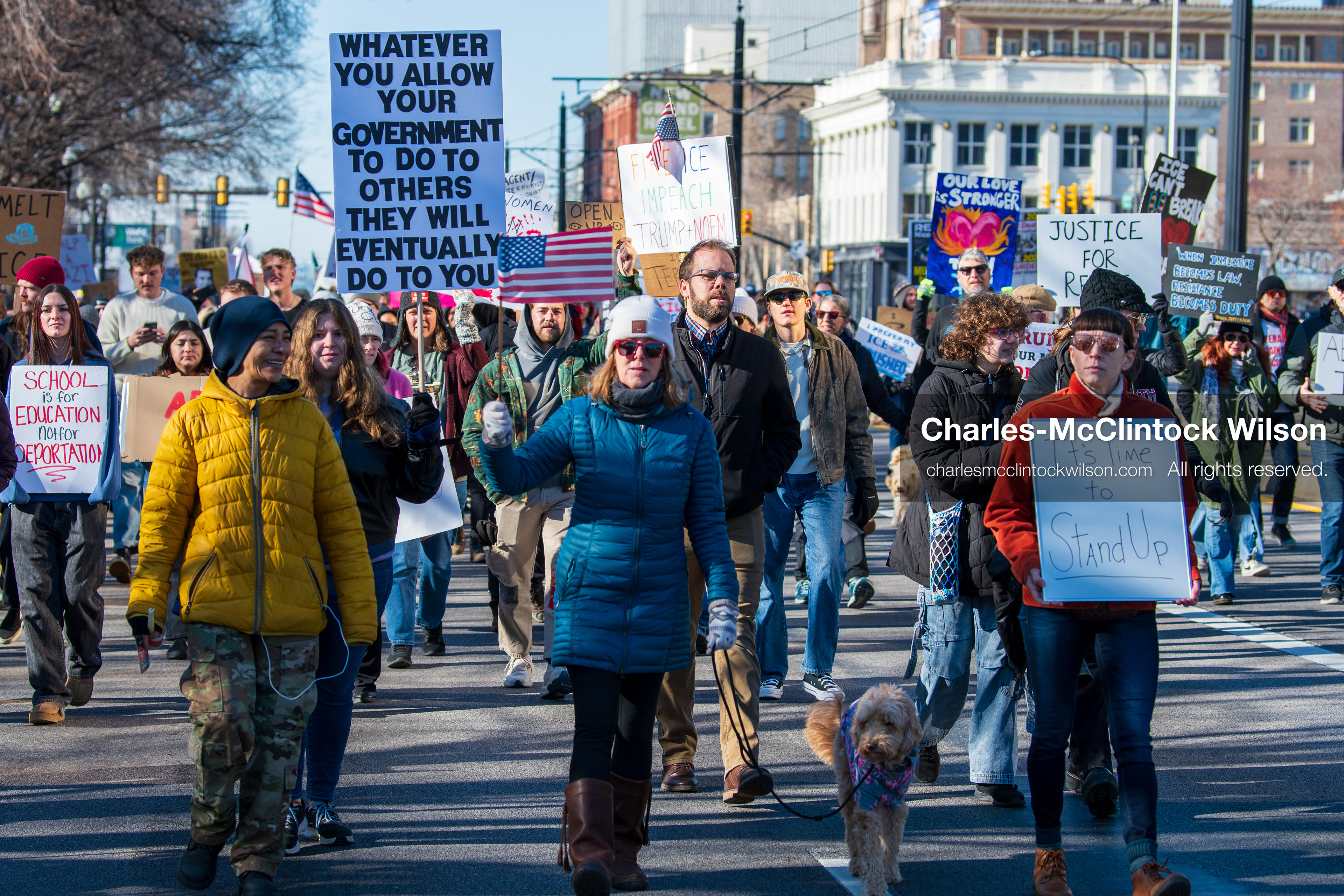 Salt Lake City, Utah, January 10, 2026: A group of demonstrators marches through downtown Salt Lake City during the ICE Out for Good protest, which began at Washington Square Park, with participants carrying signs and personal items as they walk together. (Credit Image: © Charles‑McClintock Wilson/ZUMA Press Wire)