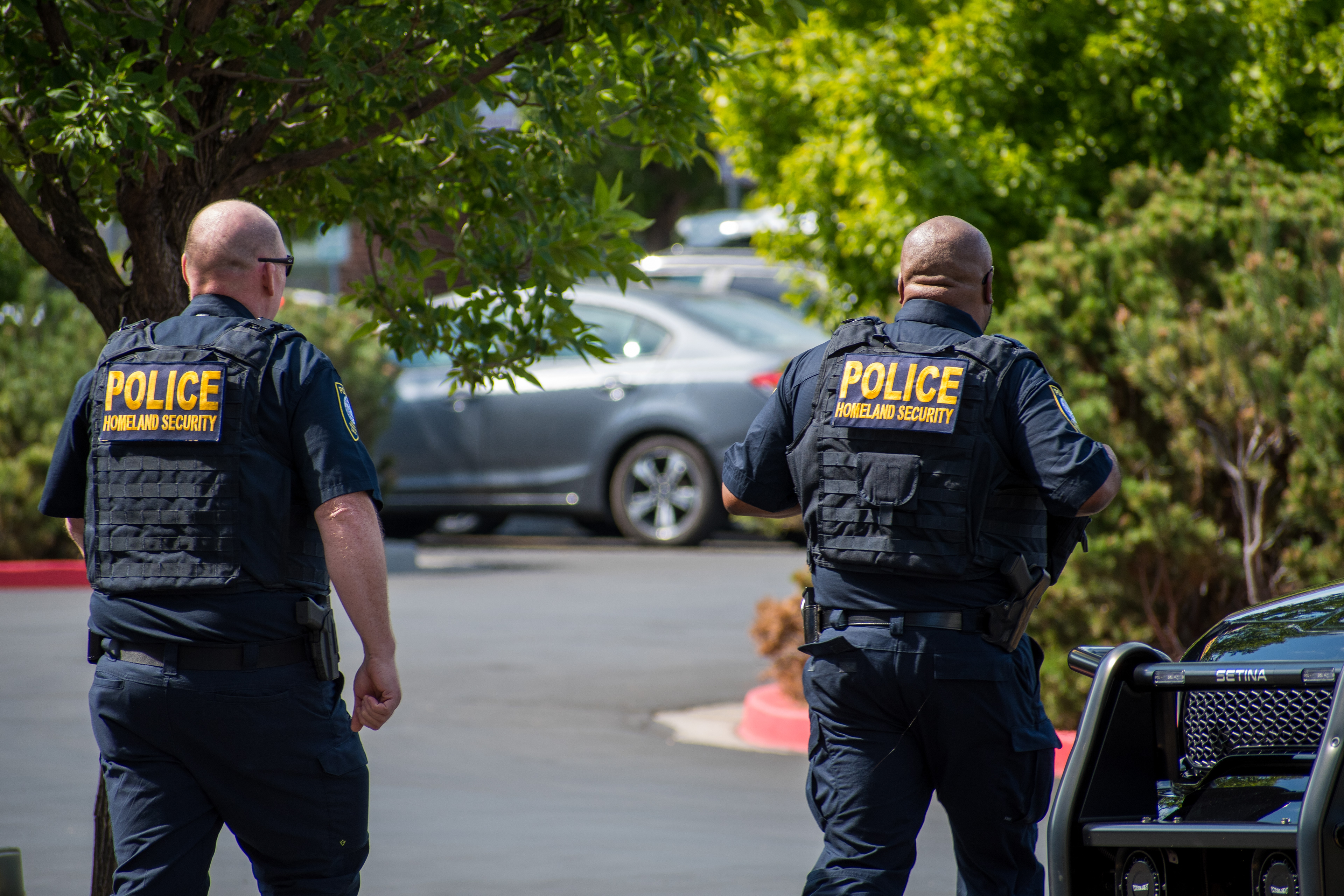 September 15, 2025 – Provo, Utah, United States: Two Homeland Security police officers walk through a parking lot near the Utah Valley Convention Center during a Department of Homeland Security career expo focused on recruiting law enforcement and security personnel. Photograph by Charles‑McClintock Wilson / ZUMA Press Wire