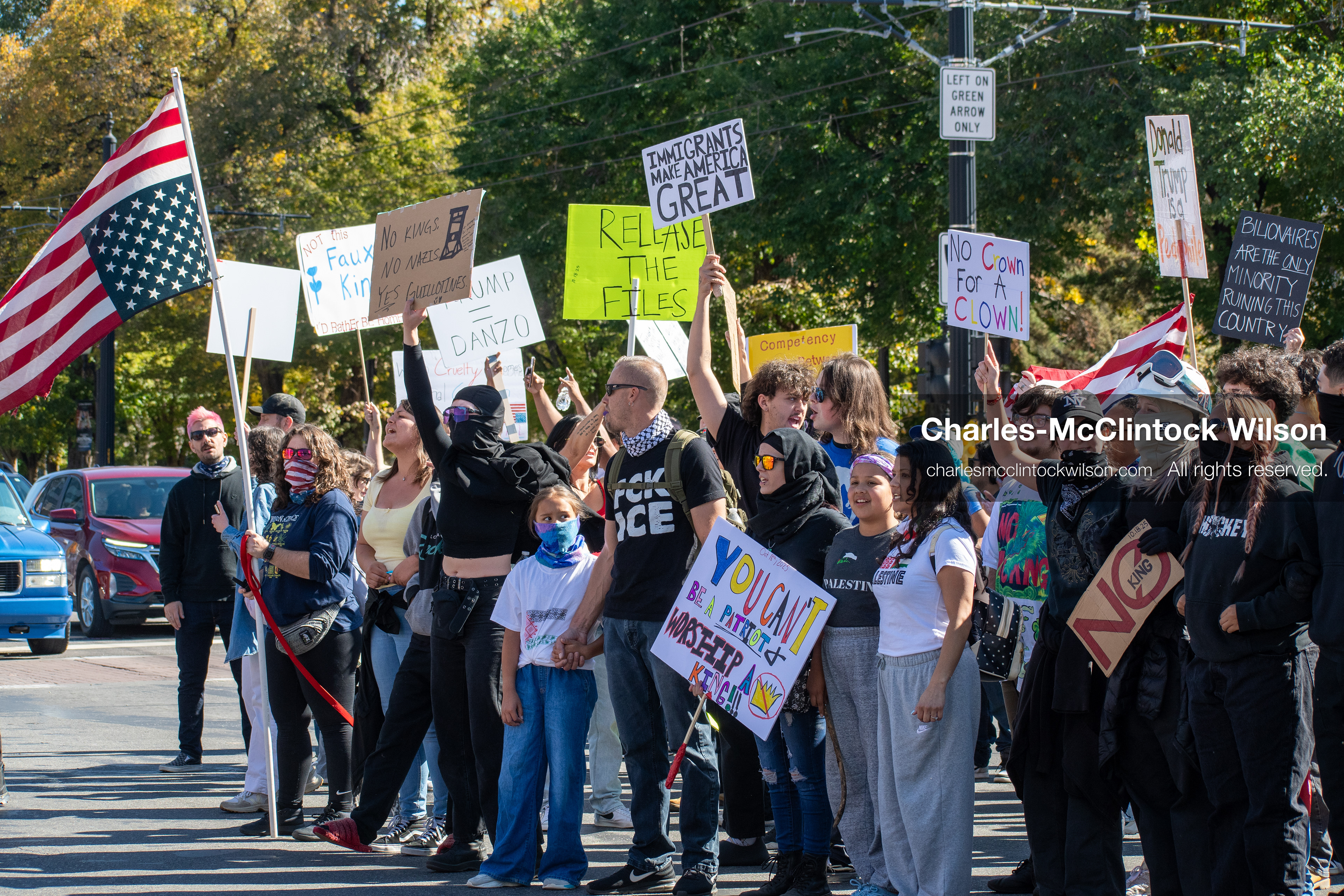 October 18, 2025, Salt Lake City, Utah, USA: Demonstrators link arms during a "No Kings" protest on South State Street in Salt Lake City, Utah. The protest was part of a nationwide mobilization.