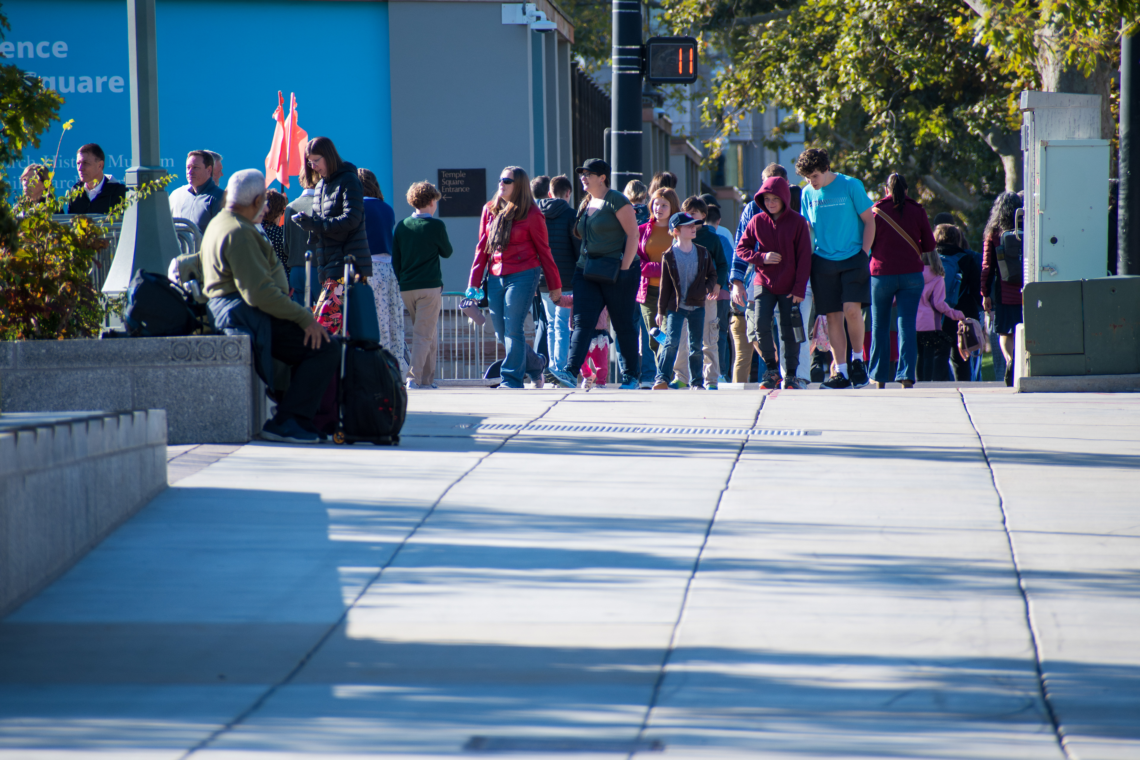 October 6, 2025, Salt Lake City, Utah, USA: People walk through the plaza outside the Conference Center during the public viewing for Russell M. Nelson, the 17th president of the Church of Jesus Christ of Latter-day Saints. Flags fly at half-mast following the death of Nelson at his home in Salt Lake City, Utah, on September 27, 2025, at the age of 101. (Credit Image: © Charles-McClintock Wilson/ZUMA Press Wire)