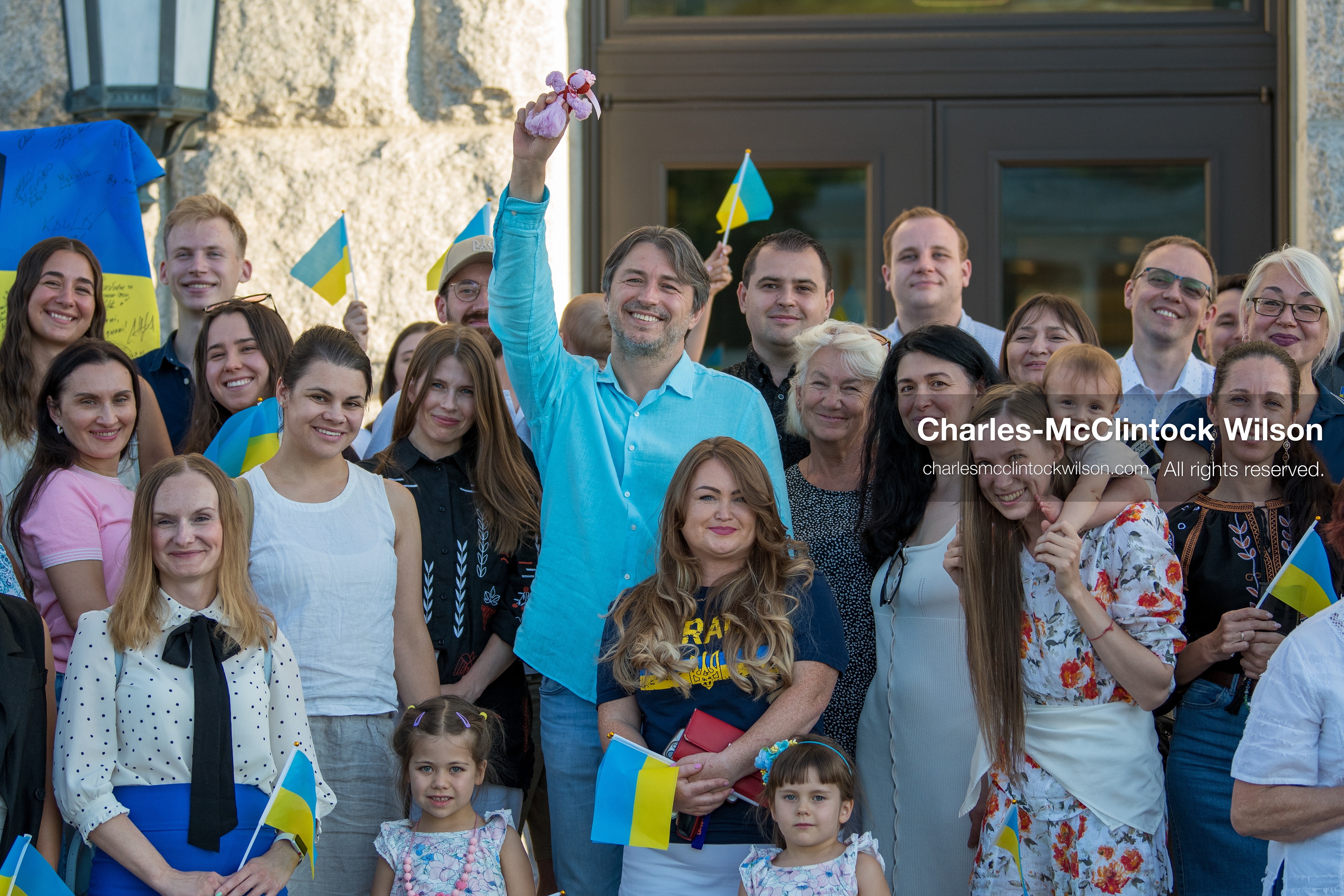 July 23, 2026, Salt Lake City, Utah, USA: Ukrainian activist SERHIY PRYTULA holds a small doll while posing for a group photograph with supporters during a community meeting at the Utah State Capitol building in Salt Lake City, Utah, on Thursday, July 23, 2026. The event, titled ''Ukraine in the Fifth Year of the Full-Scale War: An Honest Conversation,'' was hosted by the Prytula Foundation USA to discuss civil defense and ongoing humanitarian aid initiatives. (Credit Image: © Charles-McClintock Wilson/ZUMA Press Wire)