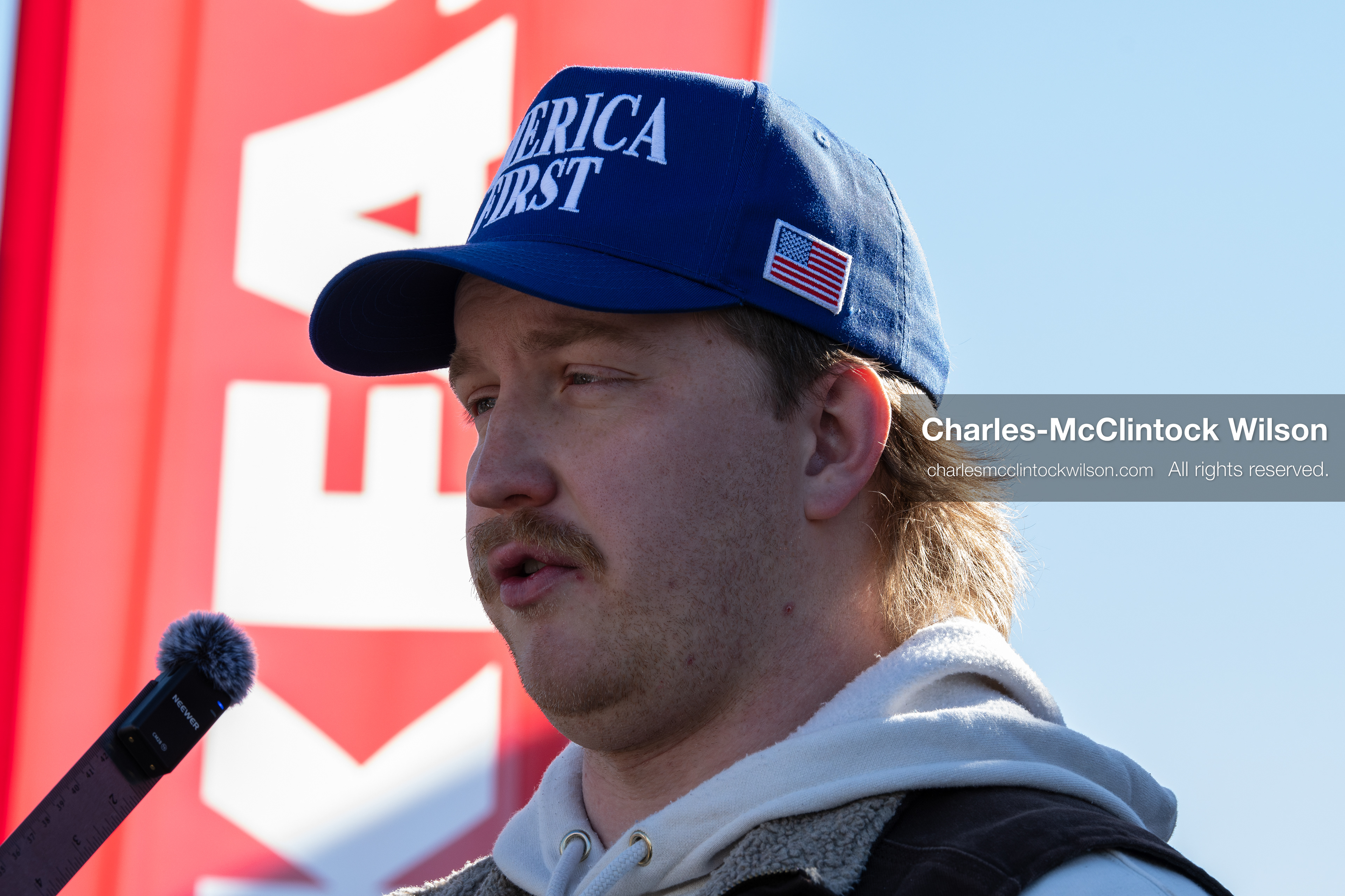 February 5, 2026, Provo, Utah, USA: A person wearing an America First hat speaks into a microphone near Brigham Young University in Provo during a gathering opposing the presence of US Customs and Border Protection recruiters at a career fair held on the BYU campus. (Credit Image: © Charles McClintock Wilson/ZUMA Press Wire)