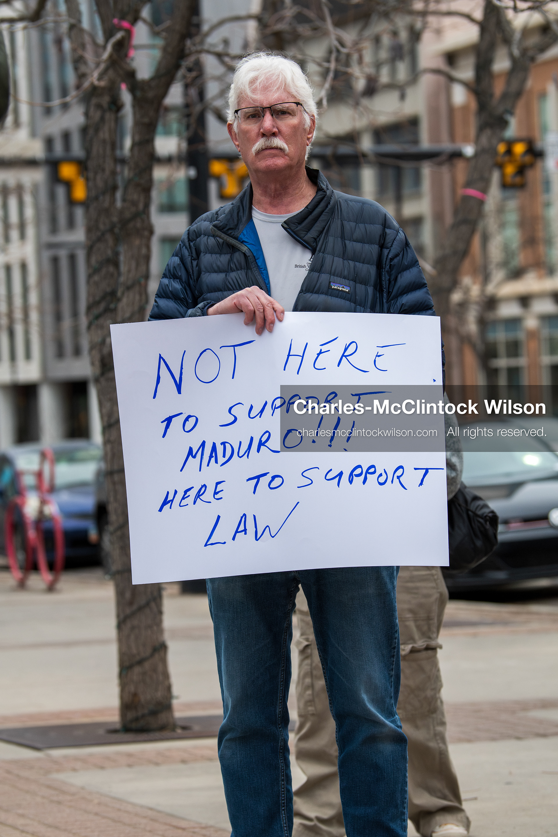 January 3, 2026, Salt Lake City, Utah, USA: A protester holds a sign during a demonstration against US action in Venezuela outside the Wallace Federal Building in Salt Lake City, Utah. The protest was part of a nationwide mobilization responding to recent military developments. (Credit Image: (c) Charles‑McClintock Wilson/ZUMA Press Wire)