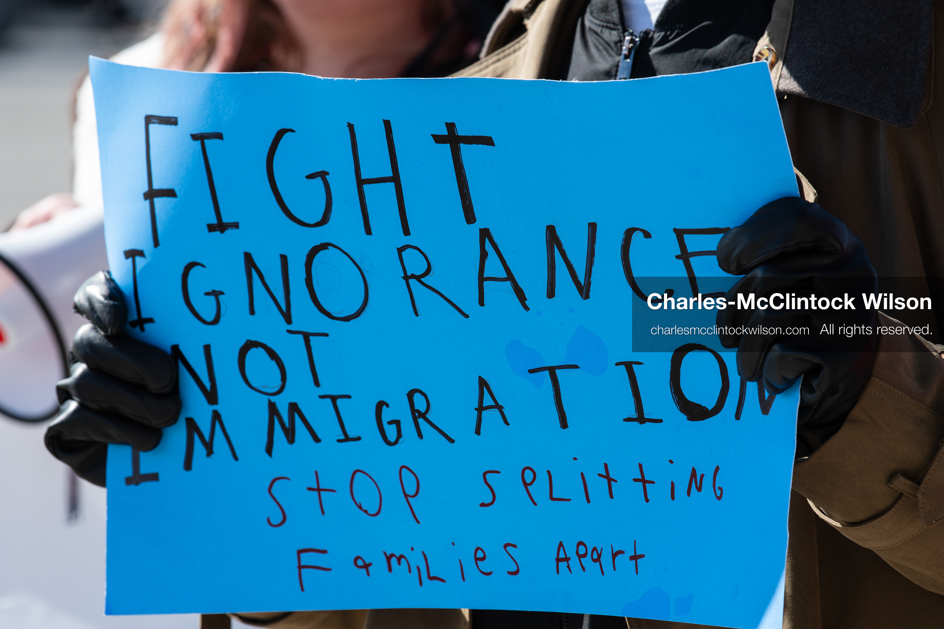 February 20, 2026, Orem, Utah, USA: Salt Lake City, Utah, Feb. 20, 2026: A participant holds a bright blue sign during a student led protest against ICE in front of Orem City Hall. Demonstrators gather along State Street as the event continues. (Credit Image: © Charles McClintock Wilson/ZUMA Press Wire)