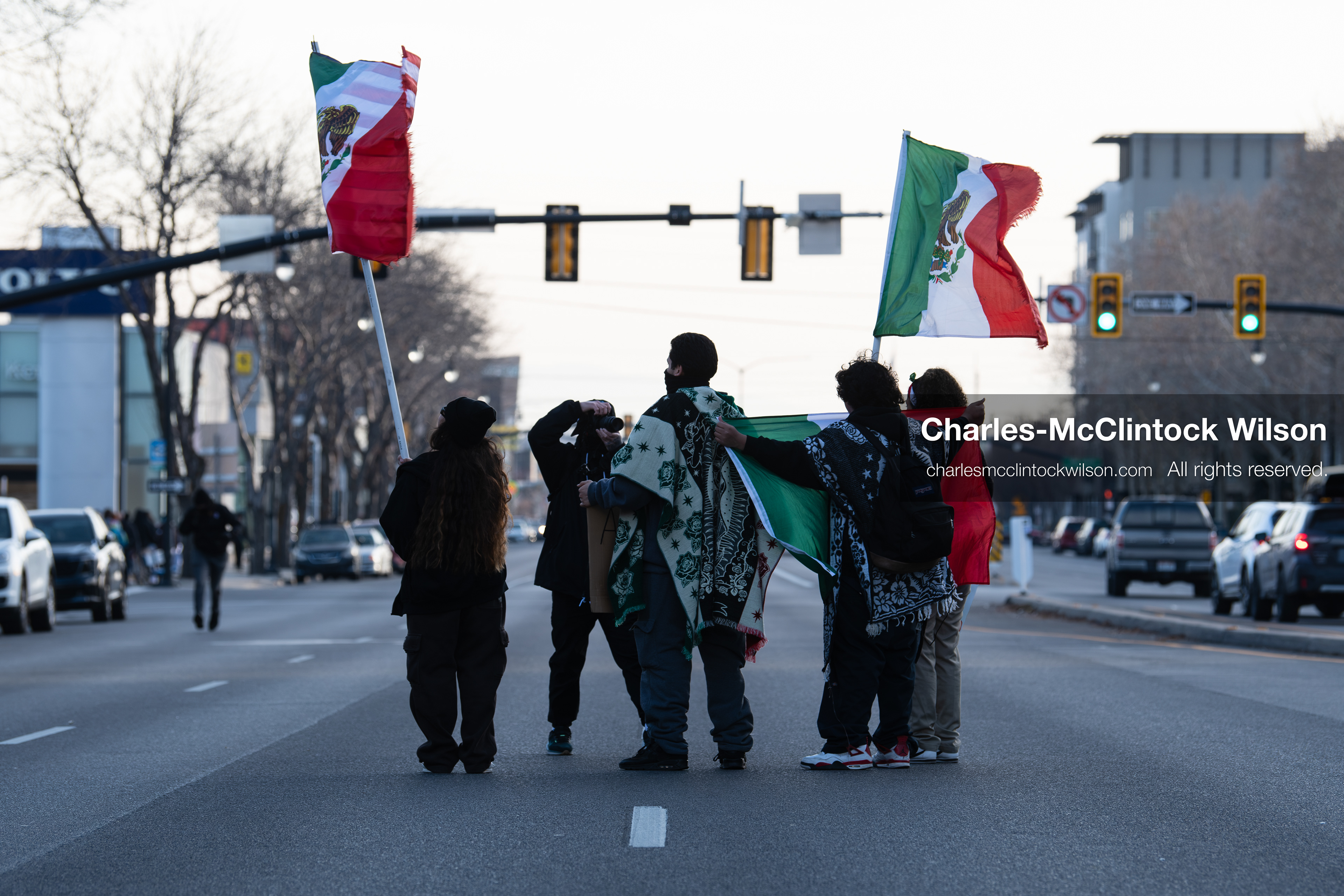 January 30, 2026, Salt Lake City, Utah, USA: Demonstrators stand in the street waving Mexican flags during an anti‑ICE protest in Salt Lake City, part of a nationwide response to immigration enforcement policies. (Credit Image: © Charles‑McClintock Wilson/ZUMA Press Wire)
