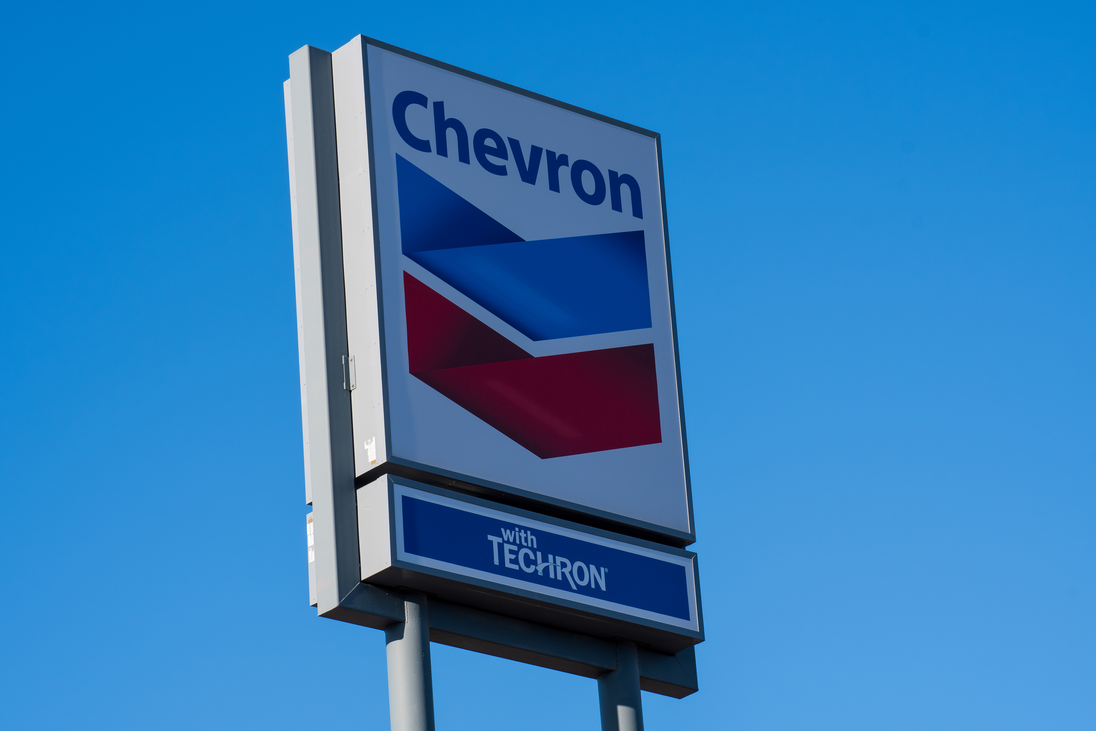 ST. GEORGE, UT, USA - MAY 4, 2025: A Chevron gas station is seen in St. George, Utah. Chevron is an American multinational energy corporation predominantly specializing in oil and gas.