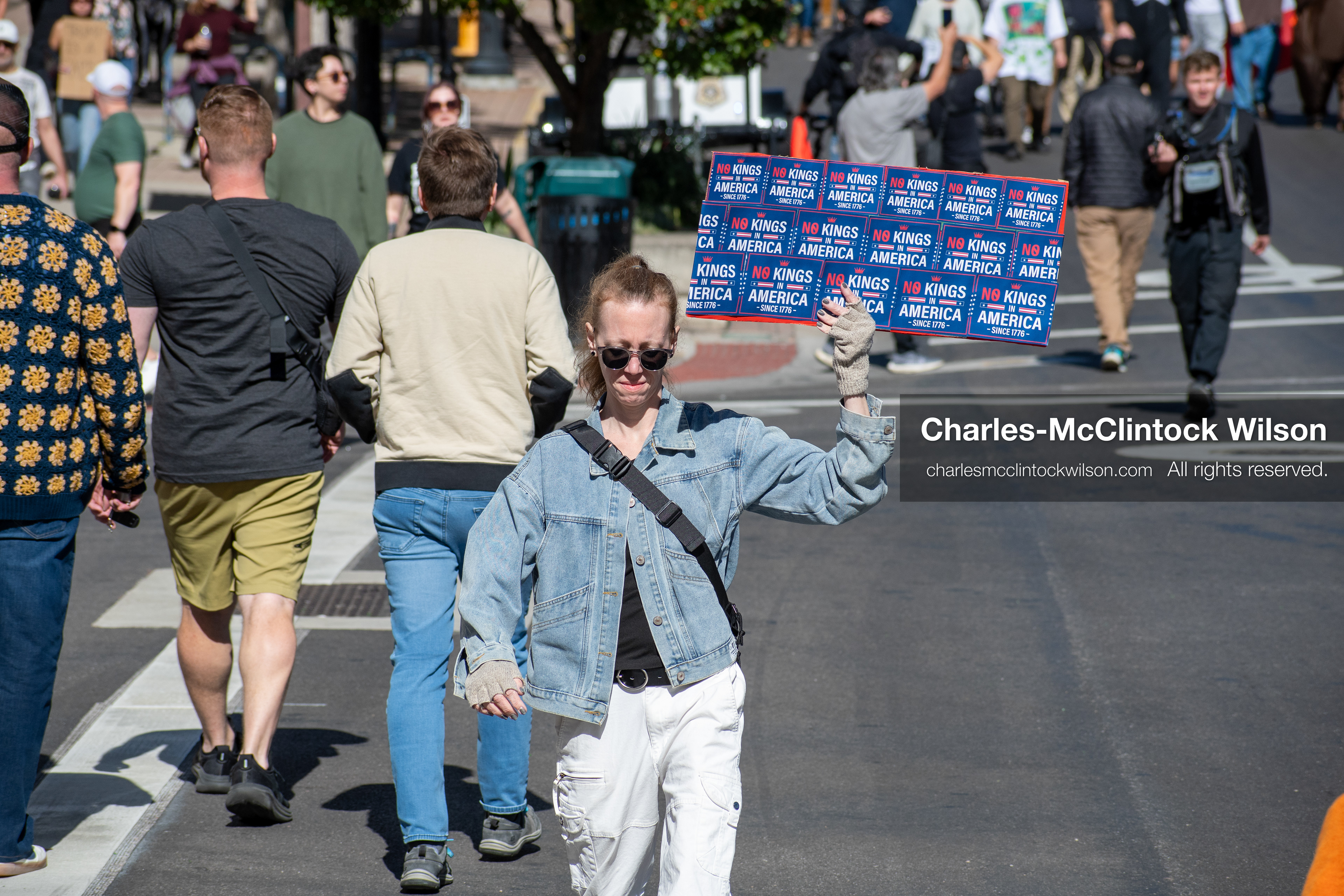 October 18, 2025, Salt Lake City, Utah, USA: Demonstrators march along South State Street during a "No Kings" protest in Salt Lake City, Utah. The protest was part of a nationwide mobilization.