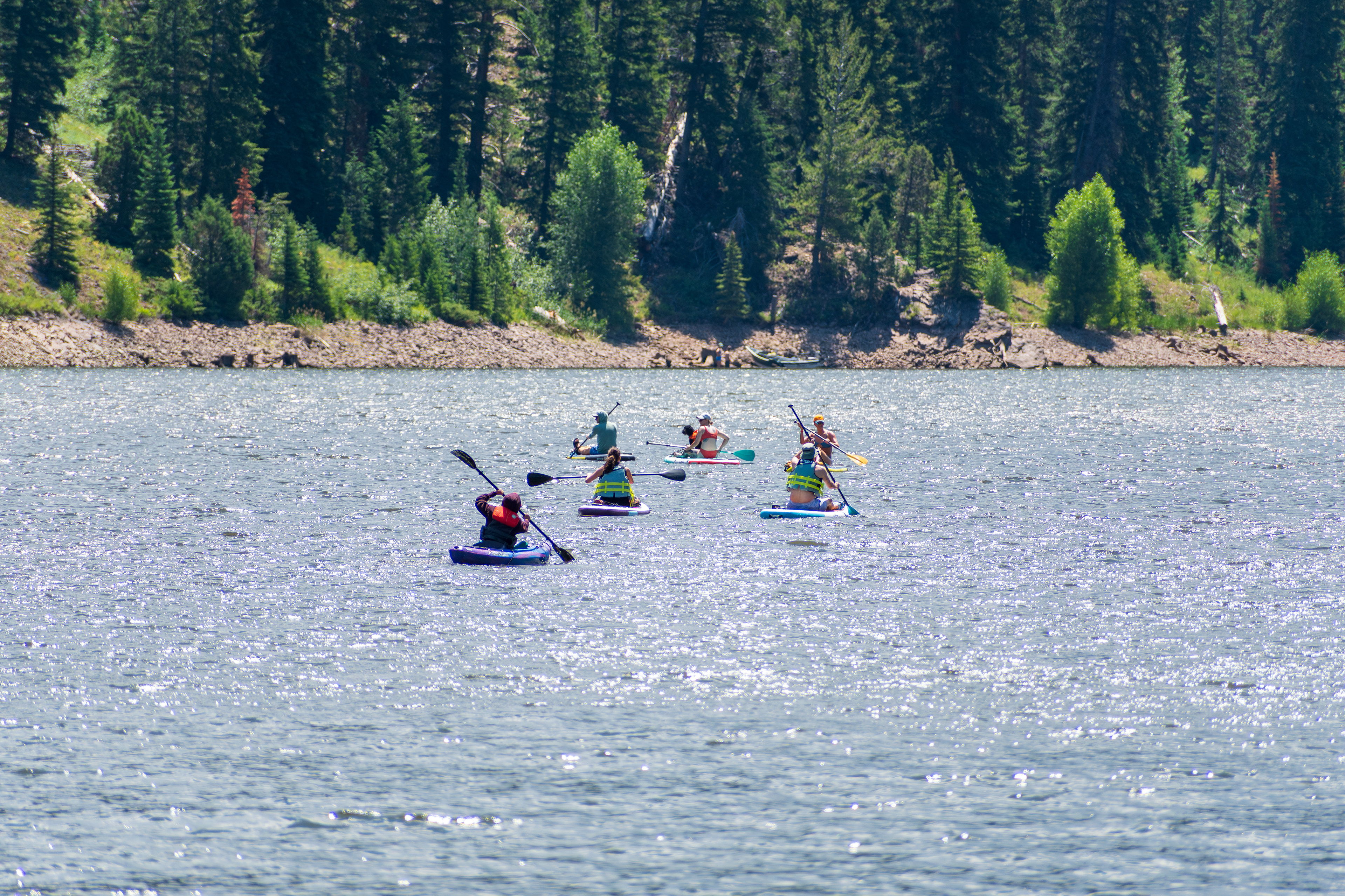 Summit County, Utah – July 20, 2025: People enjoy outdoor recreation on kayaks and paddleboards at Smith and Morehouse Reservoir.