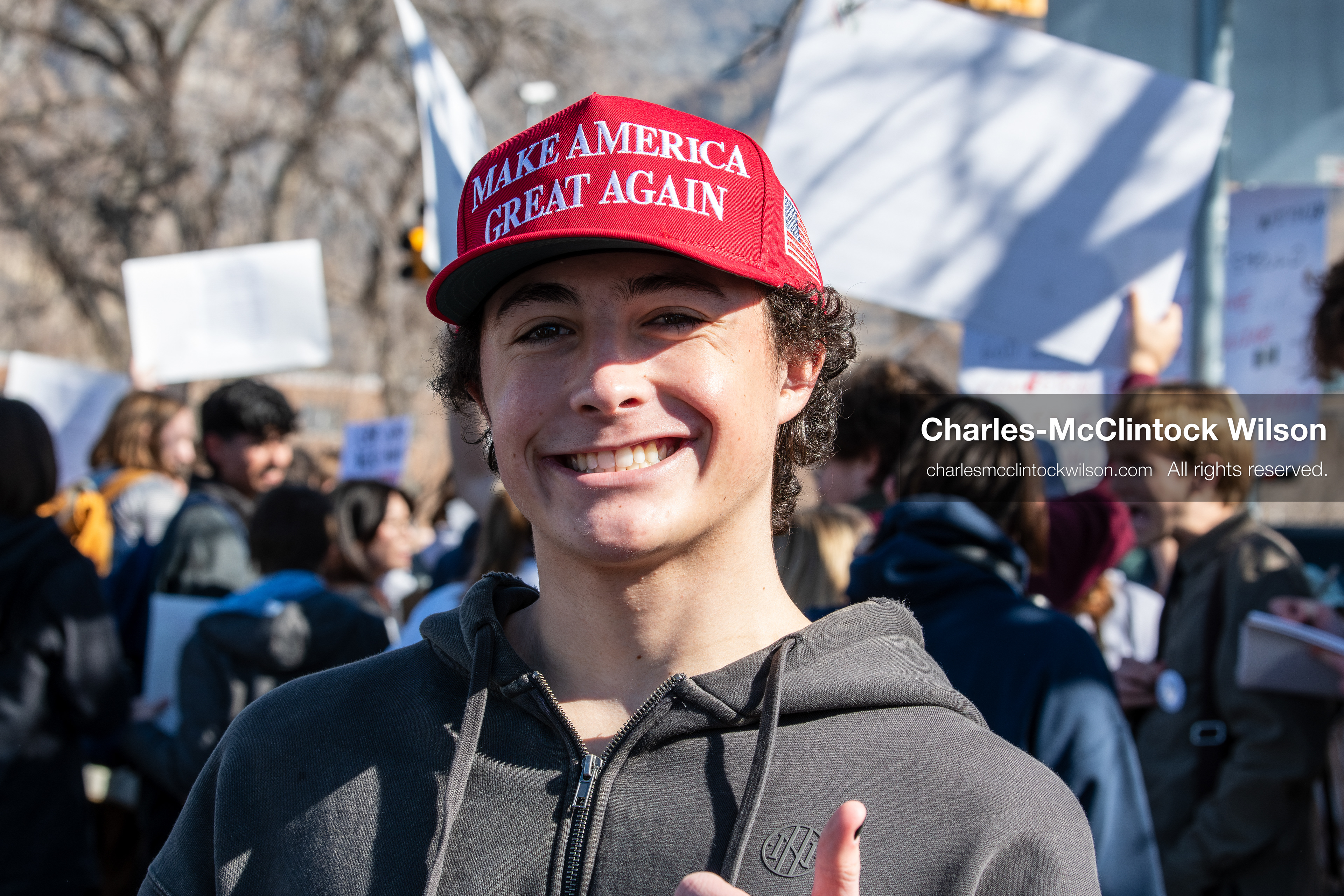 February 5, 2026, Provo, Utah, USA: A young person wearing a red Make America Great Again hat stands among demonstrators near Brigham Young University in Provo during a gathering opposing the presence of US Customs and Border Protection recruiters at a career fair held on the BYU campus. (Credit Image: © Charles McClintock Wilson/ZUMA Press Wire) 