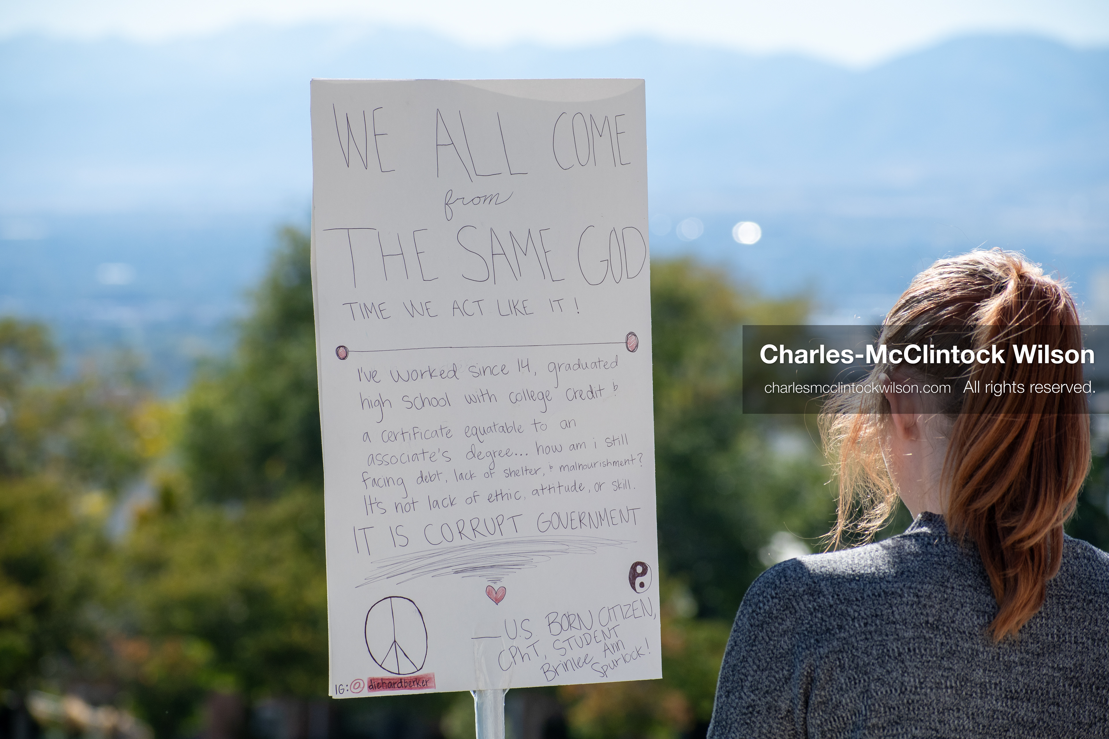 October 18, 2025, Salt Lake City, Utah, USA: A demonstrator stands with a handwritten sign during a "No Kings" protest at the Utah State Capitol in Salt Lake City, Utah. The protest was part of a nationwide mobilization.