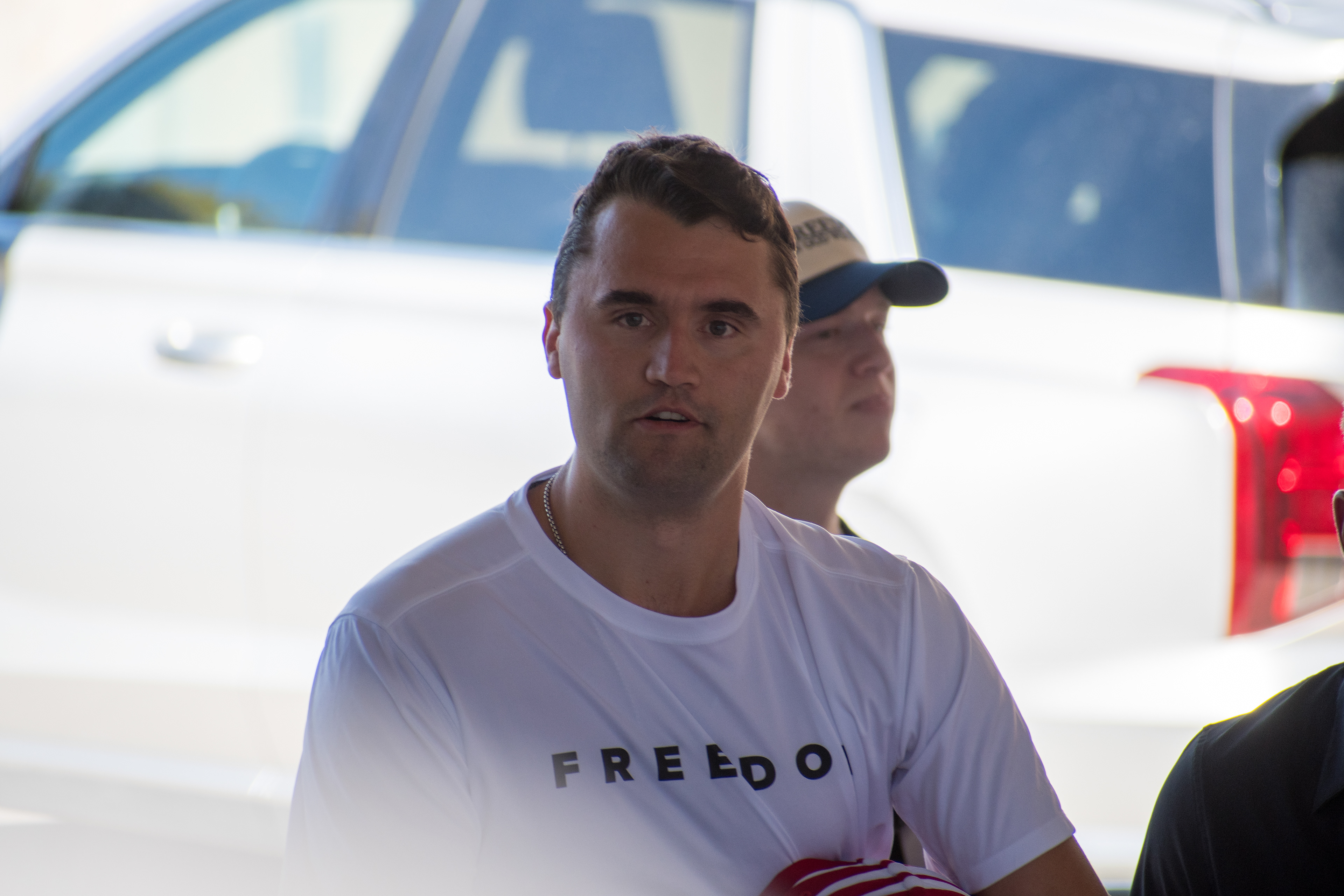 OREM, UTAH – SEPTEMBER 10, 2025: Charlie Kirk arrives at Utah Valley University for a scheduled public event. Wearing a shirt emblazoned with the word “FREEDOM,” Kirk walks among supporters and staff in a moment of visible anticipation. The image marks the beginning of his final public appearance, capturing the atmosphere of civic energy and symbolic presence that defined the day. © Charles-McClintock Wilson / ZUMA Press