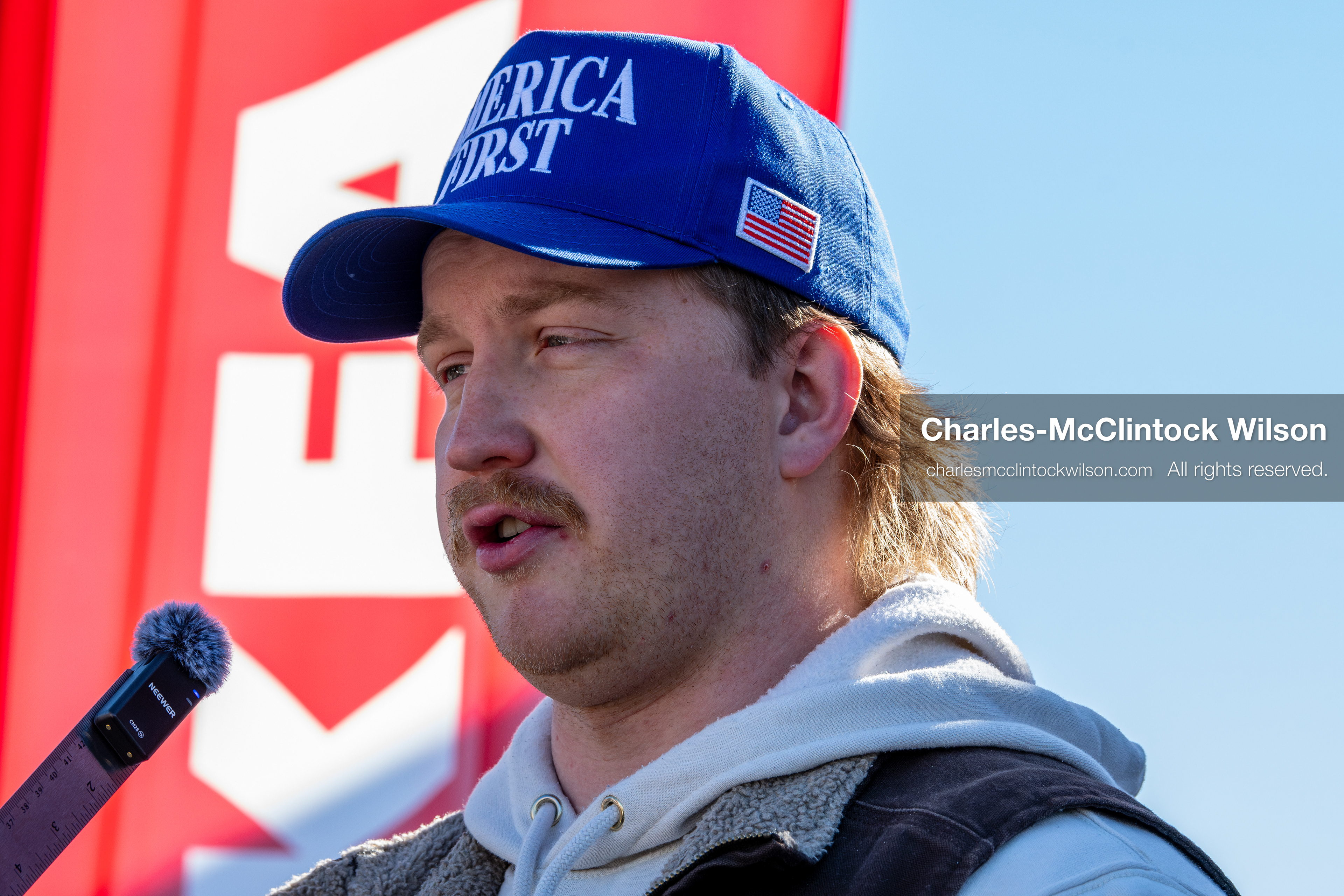 February 5, 2026, Provo, Utah, USA: A person wearing an America First hat speaks into a microphone near Brigham Young University in Provo during a gathering opposing the presence of US Customs and Border Protection recruiters at a career fair held on the BYU campus. (Credit Image: © Charles McClintock Wilson/ZUMA Press Wire)
