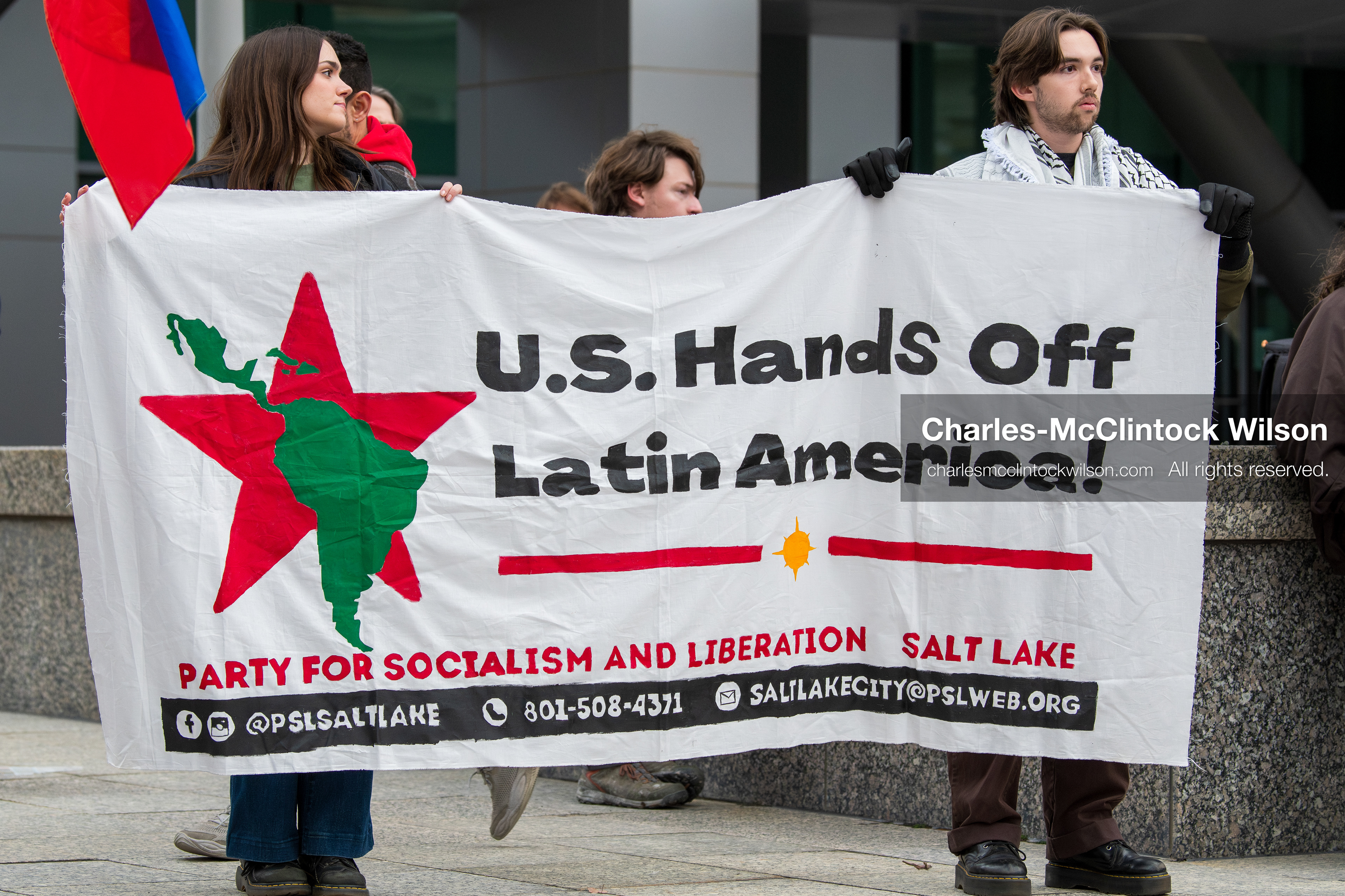 January 3, 2026, Salt Lake City, Utah, USA: Protesters display a banner during a demonstration against US action in Venezuela outside the Wallace Federal Building in Salt Lake City, Utah. The protest was part of a nationwide mobilization responding to recent military developments. (Credit Image: (c) Charles‑McClintock Wilson/ZUMA Press Wire)