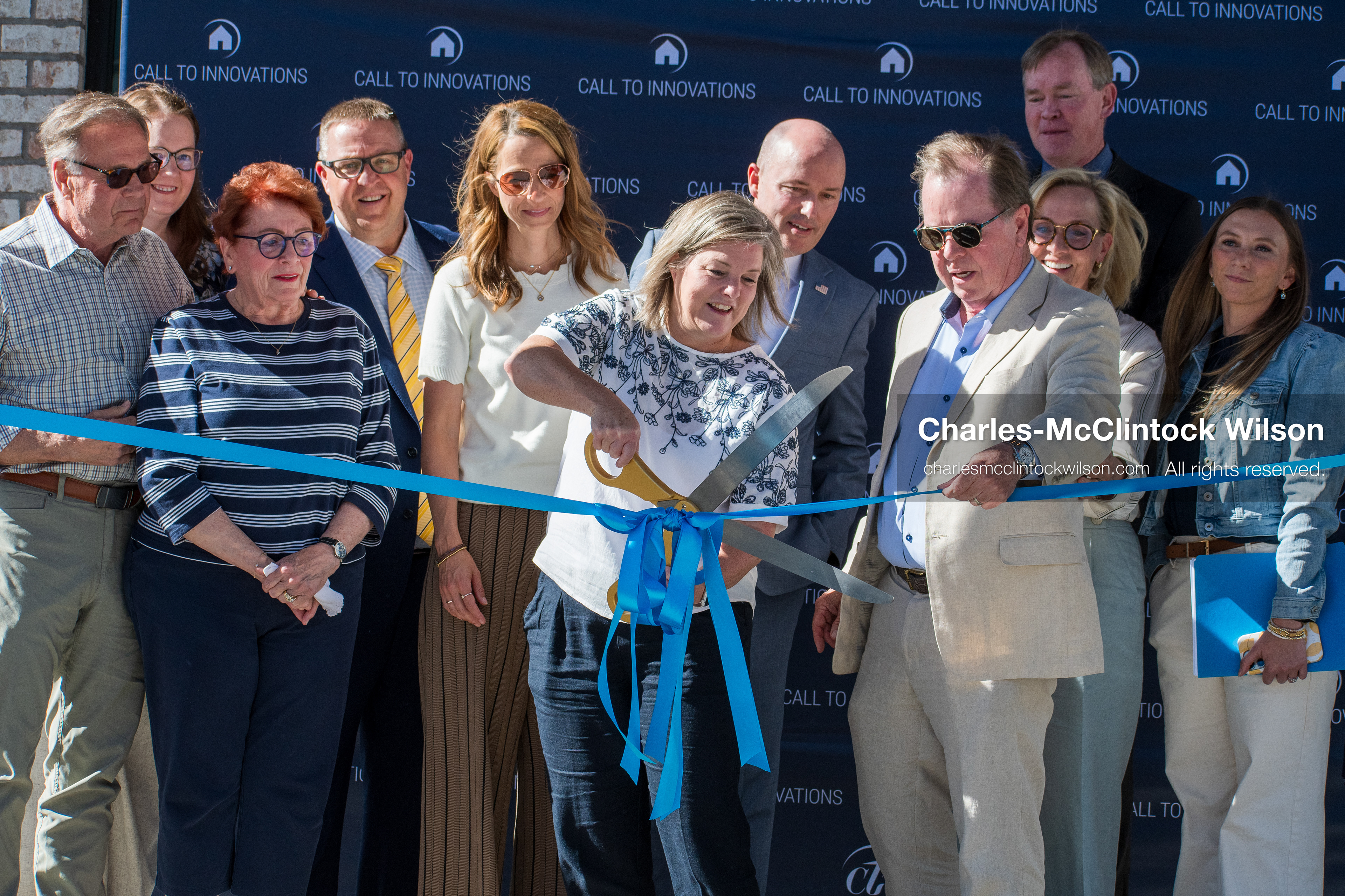 May 28, 2026, Lehi, Utah, USA: HEATHER TUCKER, director of the Lehi Literacy Center, holds the scissors as CLARK IVORY, cofounder and CEO of Ivory Homes, holds the ribbon during a ribbon cutting ceremony for the Lehi Literacy Center on May 28 2026 in Lehi Utah. (Credit Image: © Charles-McClintock Wilson/ZUMA Press Wire)