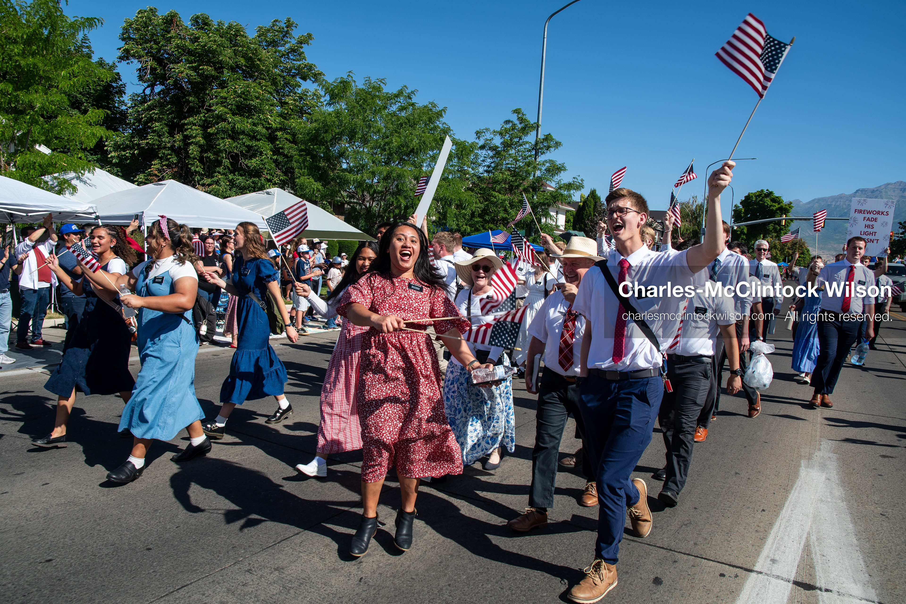 July 4, 2026, Provo, Utah, USA: Missionaries from The Church of Jesus Christ of Latter-day Saints wear black name badges and wave American flags while marching down the street during America's Freedom Festival Grand Parade in Provo, Utah, Saturday, July 4, 2026. The annual Independence Day event features expanded programming to honor the 250th anniversary of United States independence. (Credit Image: © Charles-McClintock Wilson/ZUMA Press Wire)