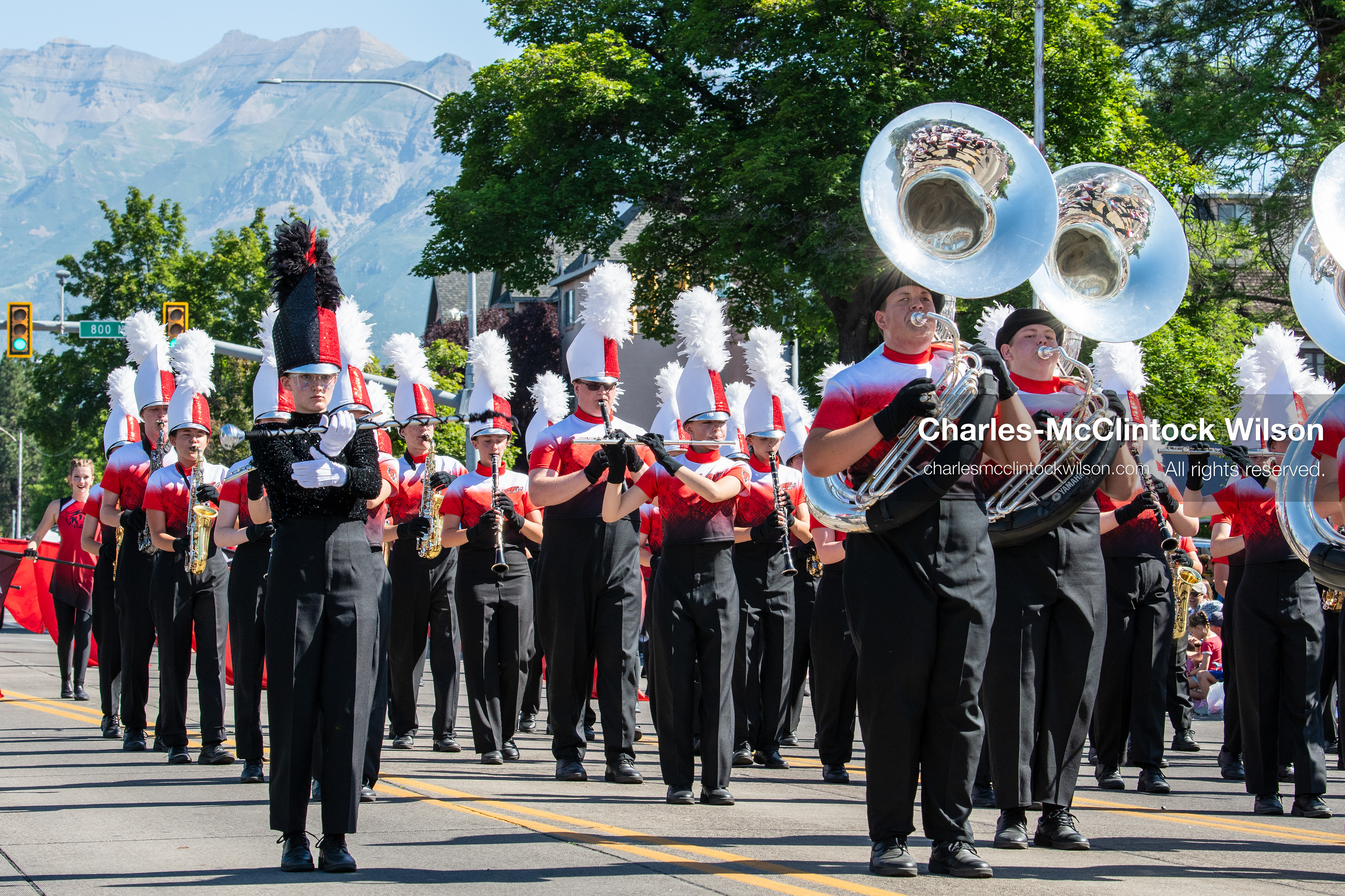 July 4, 2026, Provo, Utah, USA: Members of a high school marching band dressed in maroon and black uniforms play brass instruments while marching down the street during America's Freedom Festival Grand Parade in Provo, Utah, Saturday, July 4, 2026. The annual Independence Day event features expanded programming to honor the 250th anniversary of United States independence. (Credit Image: © Charles-McClintock Wilson/ZUMA Press Wire)