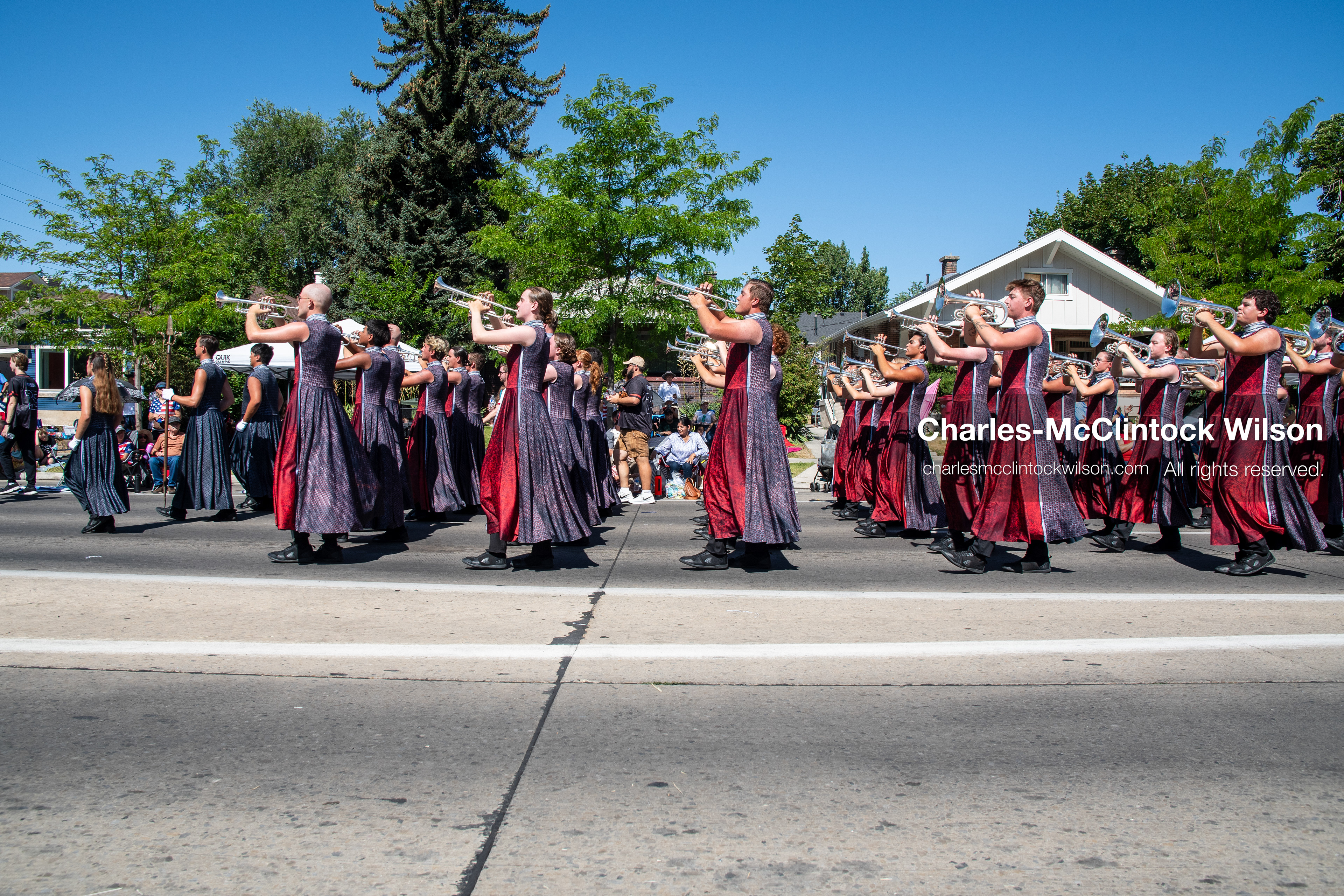 July 4, 2026, Provo, Utah, USA: Members of a high school marching band dressed in maroon and black uniforms play brass instruments while marching down the street during America's Freedom Festival Grand Parade in Provo, Utah, Saturday, July 4, 2026. The annual Independence Day event features expanded programming to honor the 250th anniversary of United States independence. (Credit Image: © Charles-McClintock Wilson/ZUMA Press Wire)