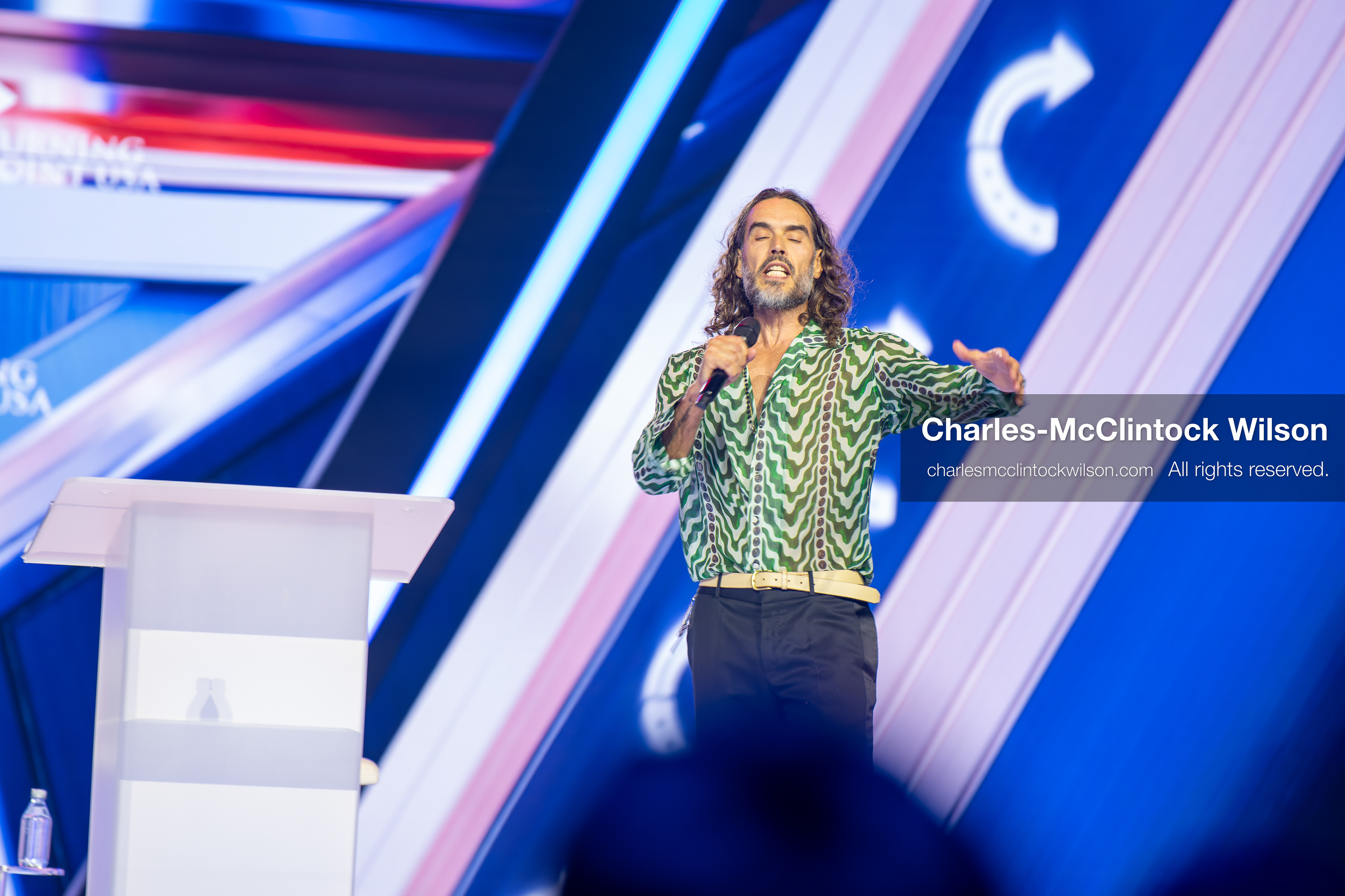 December 18, 2025, Phoenix, Arizona, USA: Russell Brand speaks during Day One of Turning Point USA’s AmericaFest 2025 at the Phoenix Convention Center in Phoenix, Arizona.   (Credit Image: © Charles‑McClintock Wilson/ZUMA Press Wire)