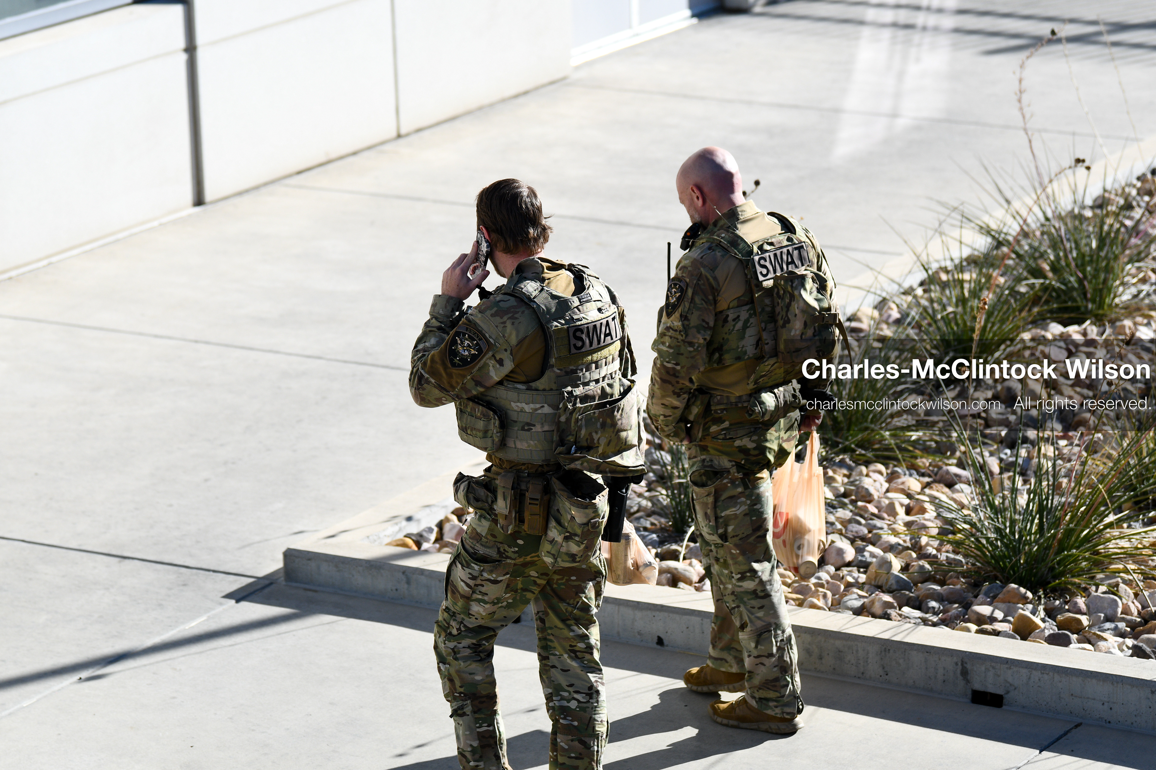 PROVO, UTAH, USA – DECEMBER 11, 2025: Two SWAT members walk near the Fourth District Court in Provo during the first in‑person court appearance of Tyler Robinson in the Charlie Kirk murder case. (Credit Image: © Charles‑McClintock Wilson/ZUMA Press Wire)