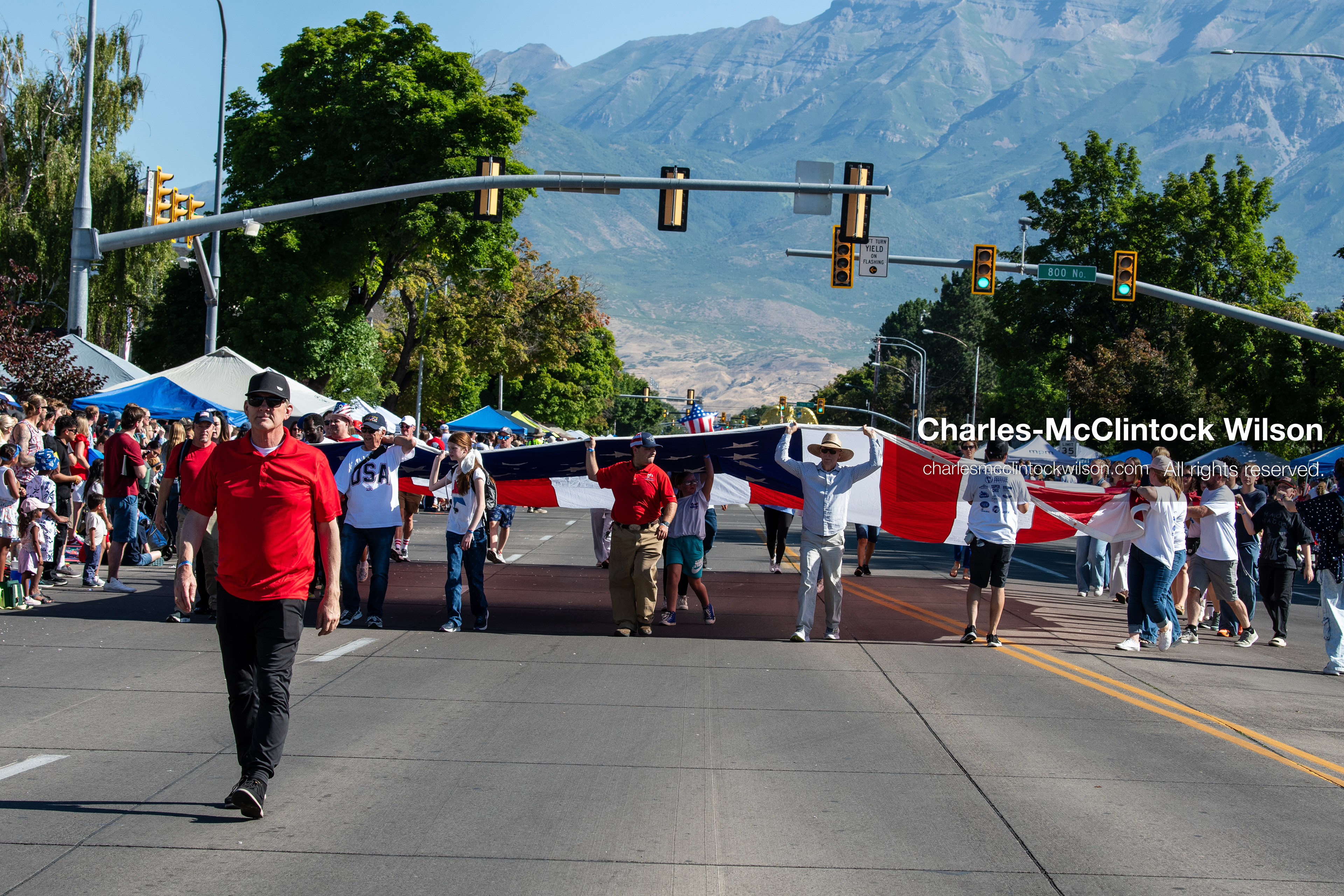 July 4, 2026, Provo, Utah, USA: A synchronized group of walking participants carries an elongated patriotic banner across the width of the street during America's Freedom Festival Grand Parade in Provo, Utah, Saturday, July 4, 2026. The annual Independence Day event features expanded programming to honor the 250th anniversary of United States independence. (Credit Image: © Charles-McClintock Wilson/ZUMA Press Wire)