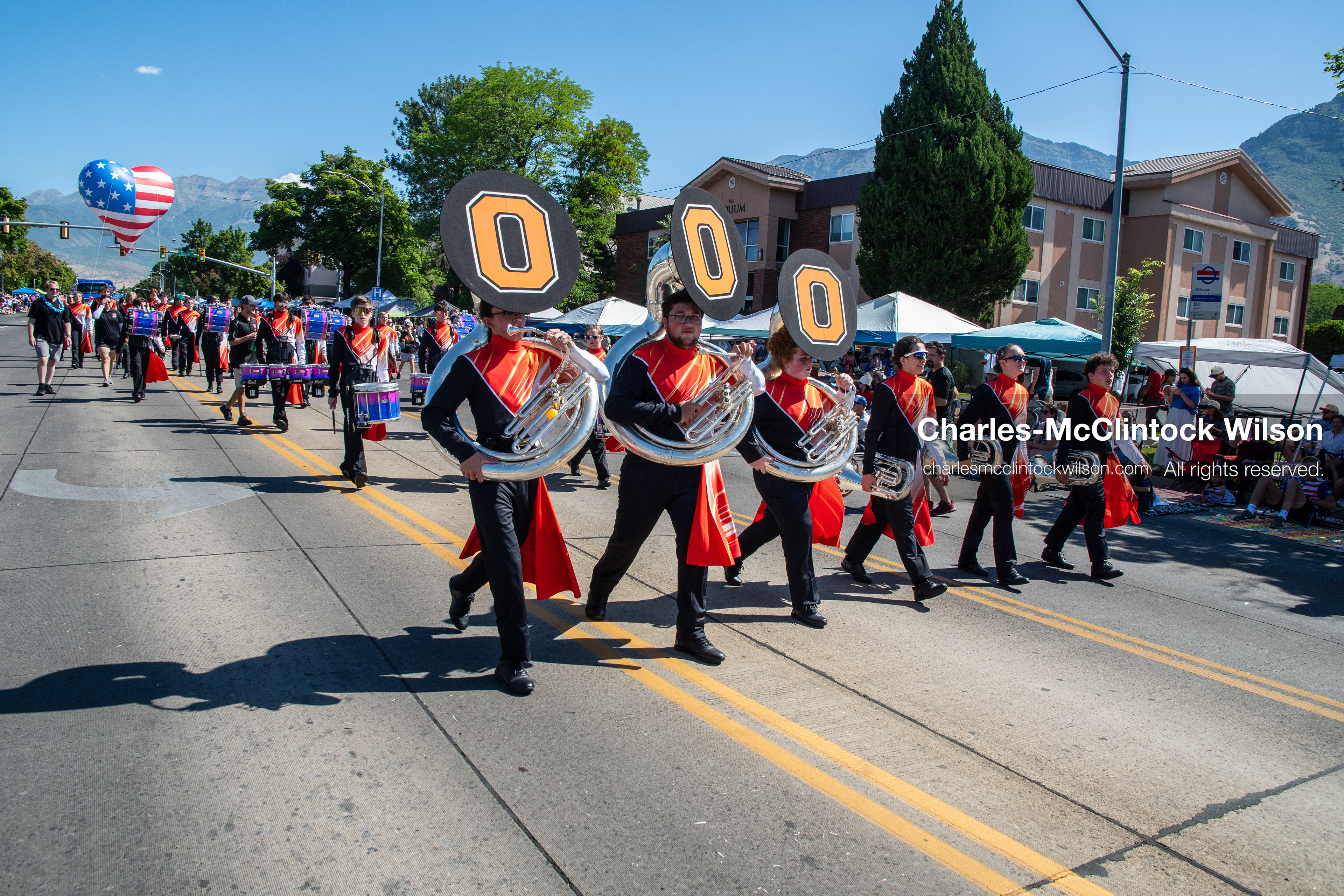 July 4, 2026, Provo, Utah, USA: Members of a high school marching band dressed in maroon and black uniforms play brass instruments while marching down the street during America's Freedom Festival Grand Parade in Provo, Utah, Saturday, July 4, 2026. The annual Independence Day event features expanded programming to honor the 250th anniversary of United States independence. (Credit Image: © Charles-McClintock Wilson/ZUMA Press Wire)