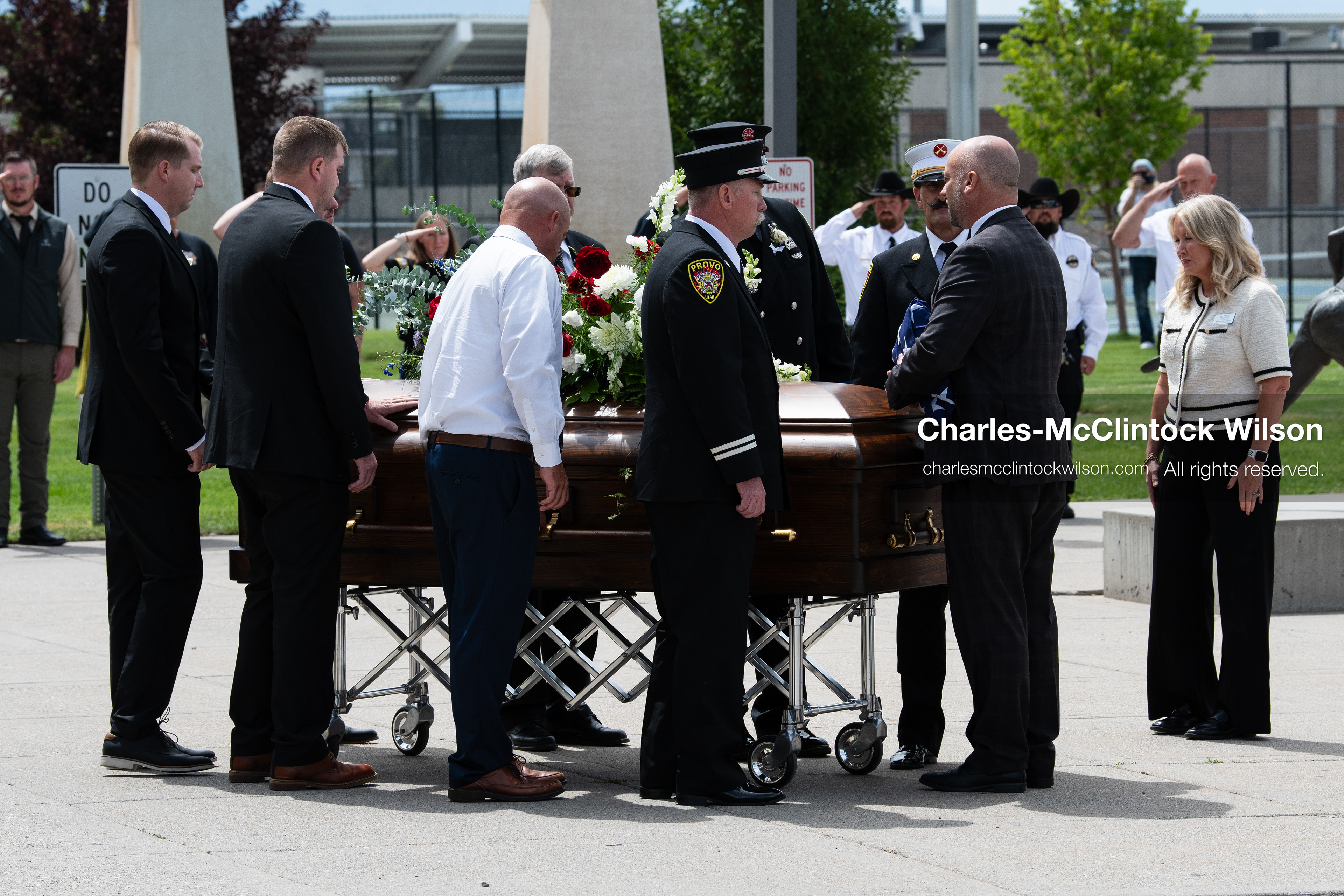 Firefighters and pallbearers escort the casket of Provo Fire Captain Spencer Long outside the UCCU Center on the campus of Utah Valley University in Orem, Utah, on Wednesday, July 29, 2026. More than 300 people came to the public memorial ceremony to honor Captain Long, his wife Katrina, and three of their sons, who died after a flash flood hit their campsite near the Sunglow Campground in Wayne County. (Photo by Charles-McClintock Wilson/Sipa USA)
