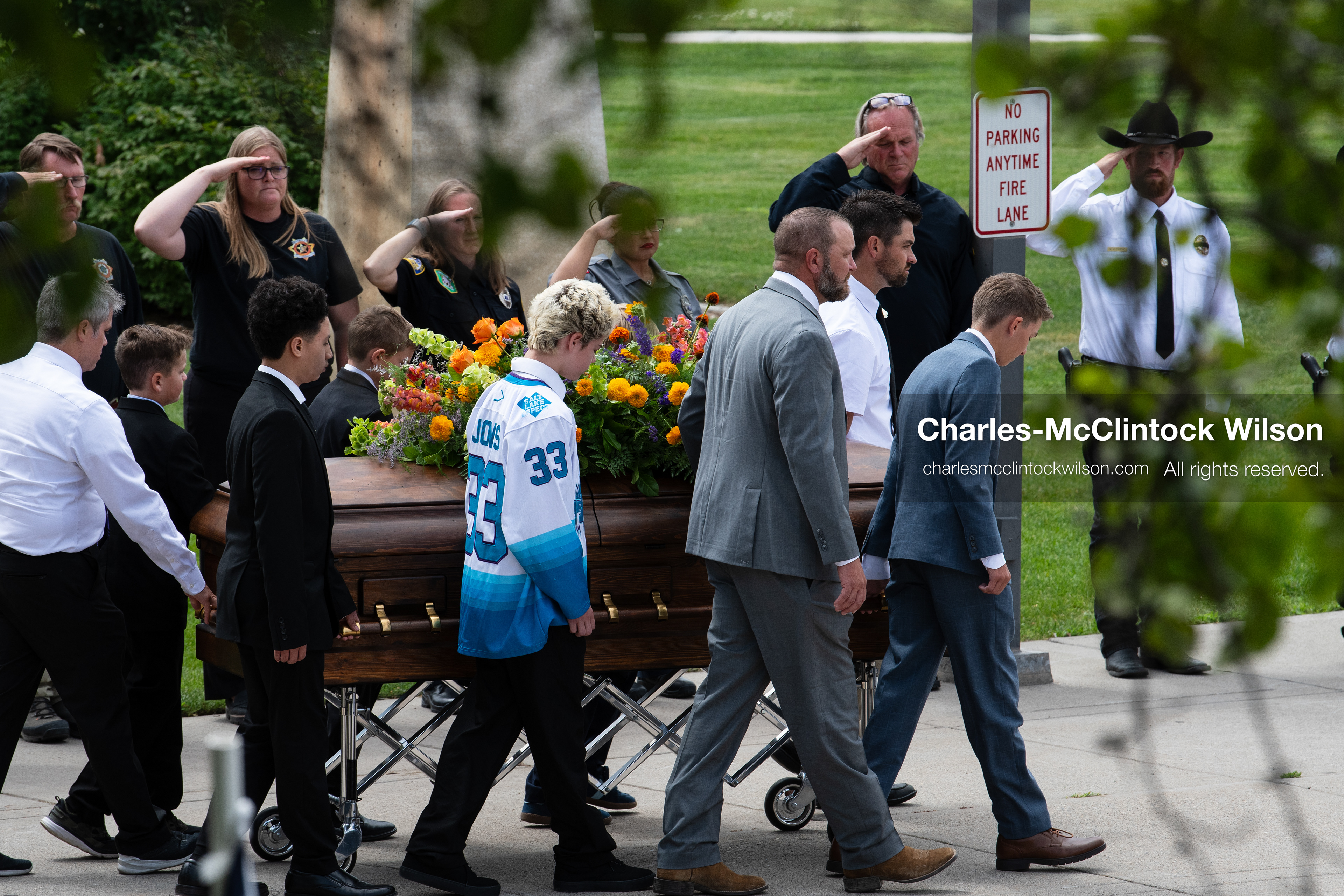 Pallbearers and family members escort the casket of a Long family member outside the UCCU Center at Utah Valley University in Orem, Utah, on Wednesday, July 29, 2026. More than 300 people came to the public memorial ceremony to honor Provo Fire Captain Spencer Long, his wife Katrina, and three of their sons, who died after a flash flood hit their campsite near the Sunglow Campground in Wayne County. (Photo by Charles-McClintock Wilson/Sipa USA)