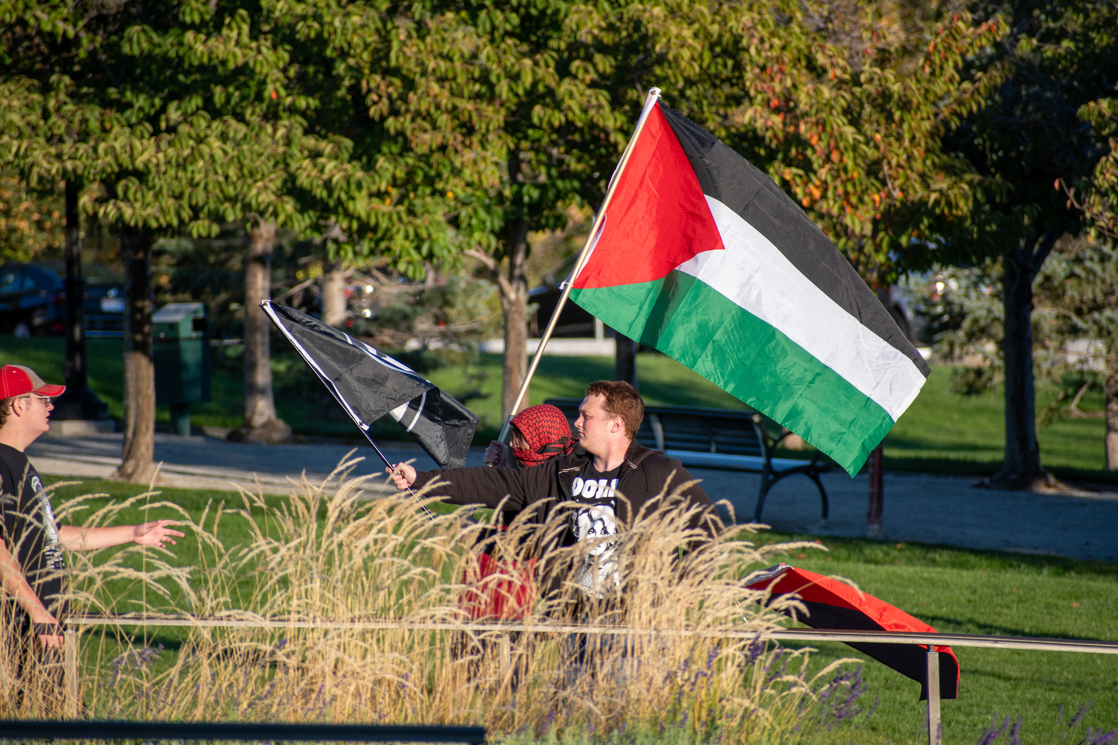 October 10, 2025, Salt Lake City, Utah, USA: Pro-Palestine demonstrators walk in front of the Utah State Capitol during the Free Palestine Rally. One participant carries a Palestinian flag near the building's neoclassical columns. (Credit Image: © Charles-McClintock Wilson/ZUMA Press Wire)